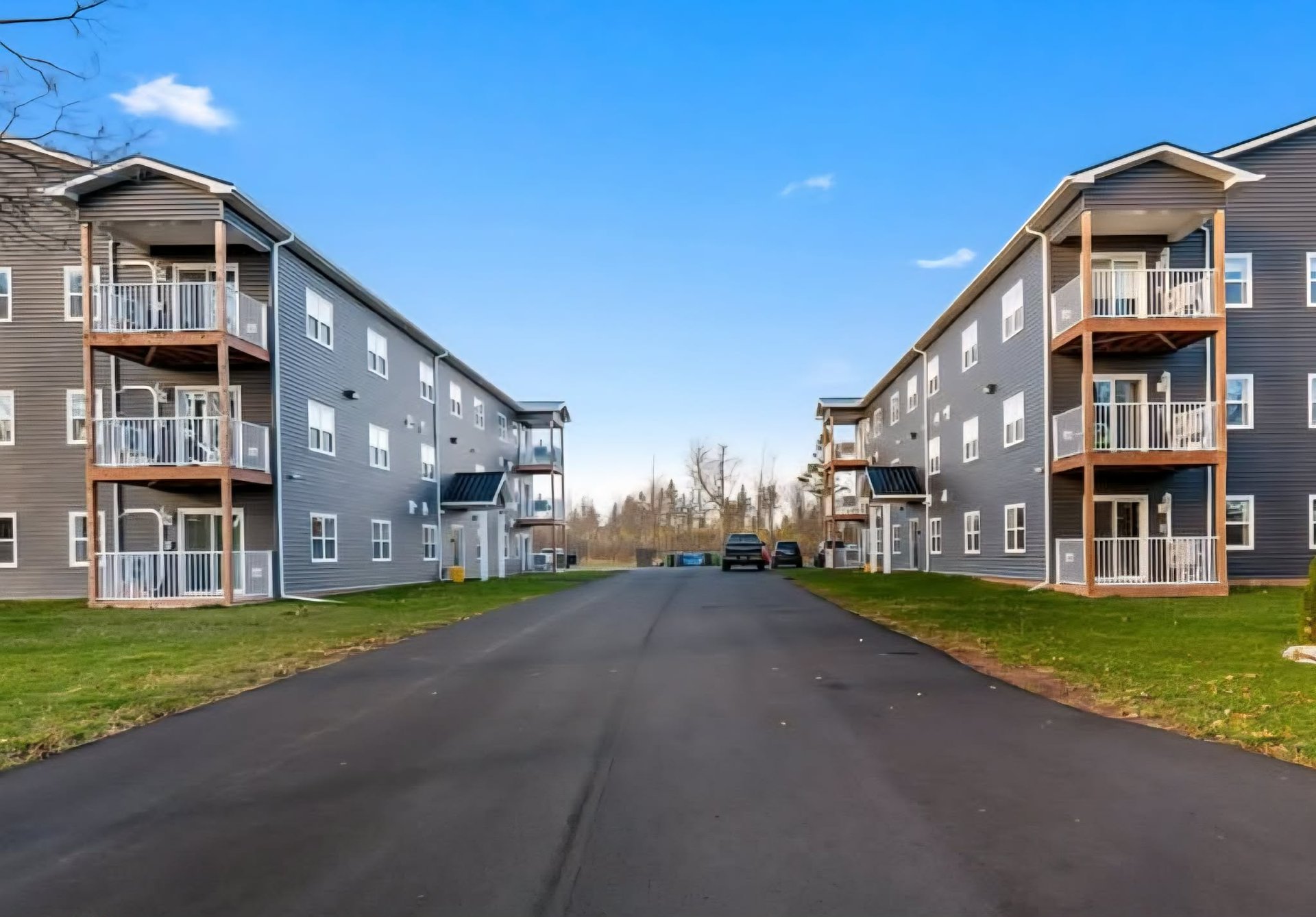 an abstract photo of a curved building with a blue sky in the background