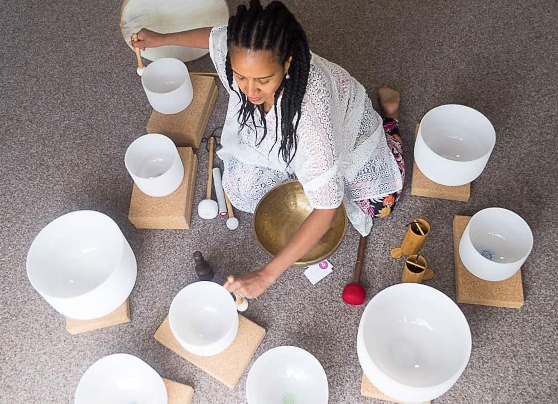 woman in black tank top and black leggings doing yoga