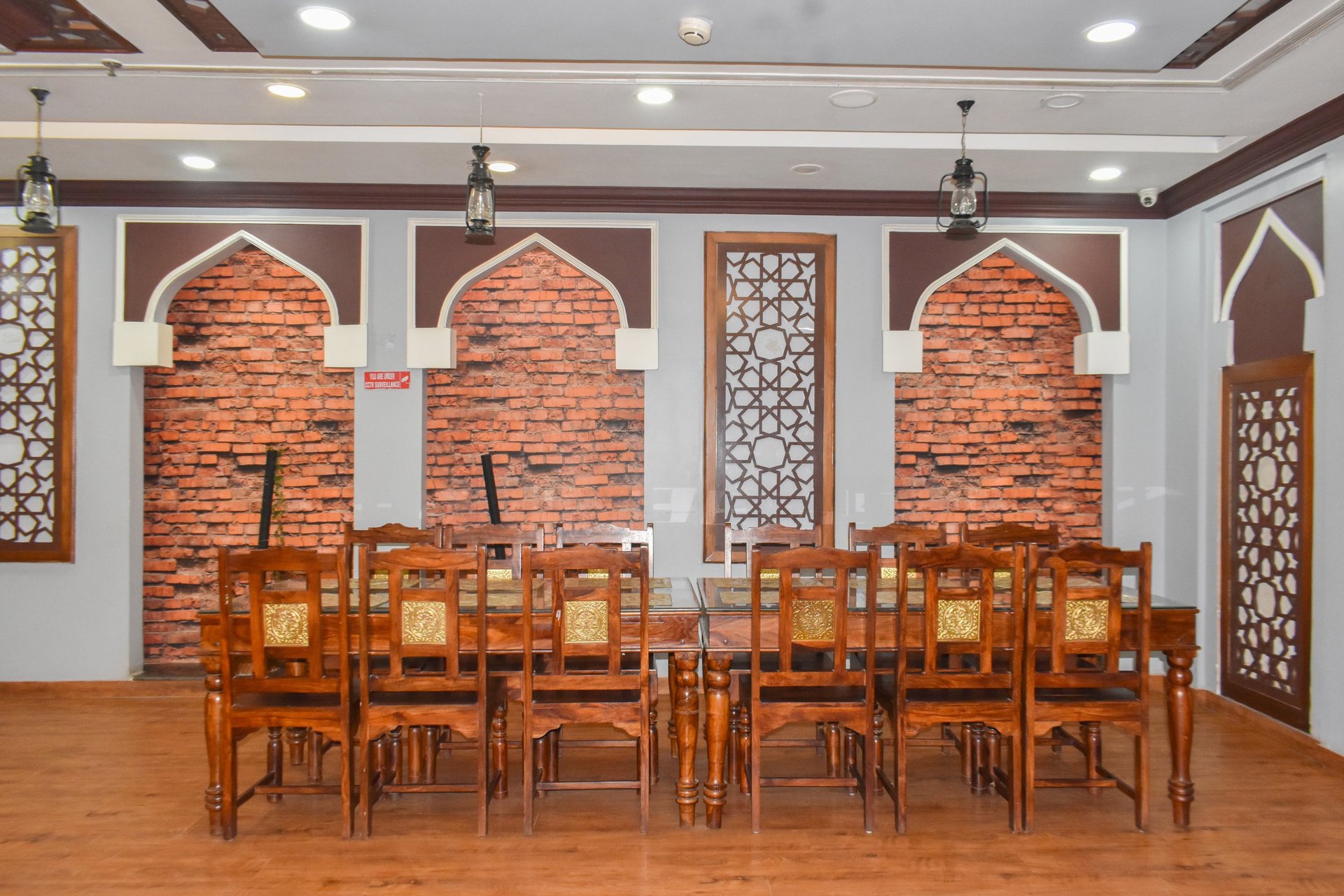 low-angle photo of Hotel lighted signage on top of brown building during nighttime