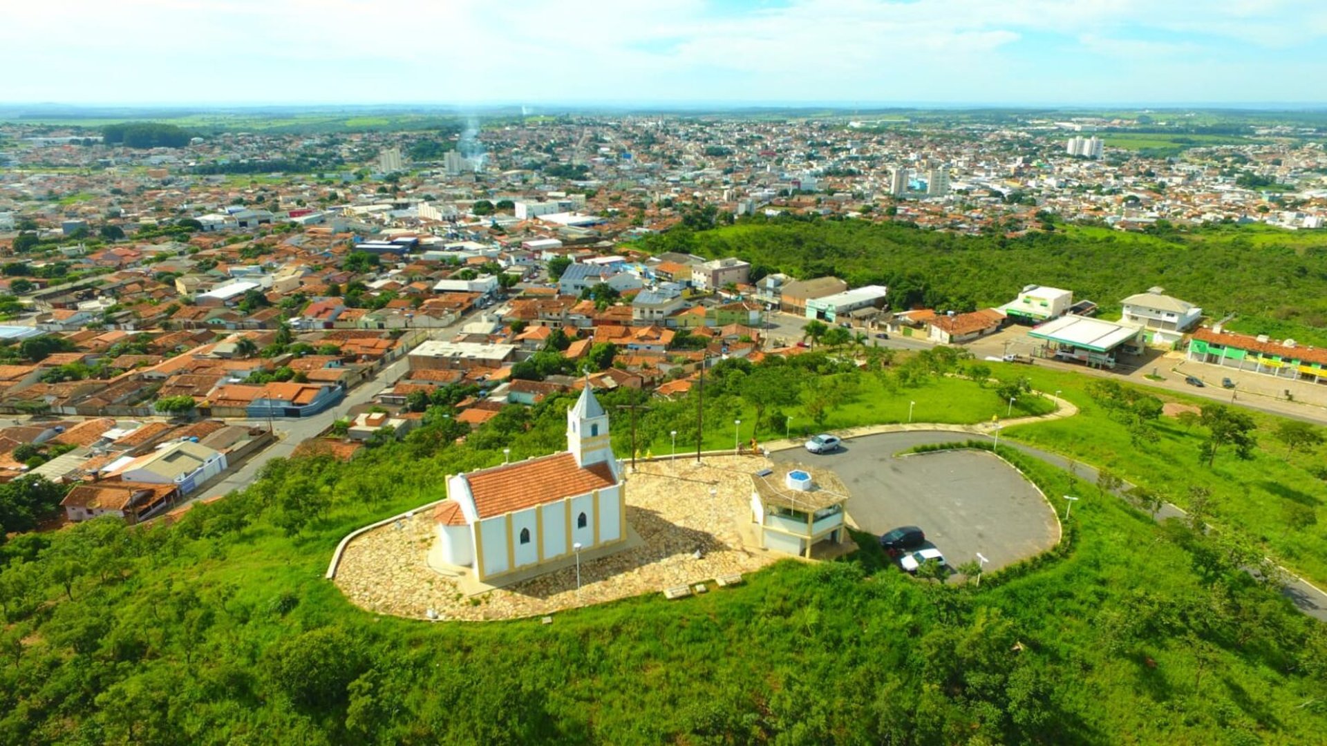 an abstract photo of a curved building with a blue sky in the background