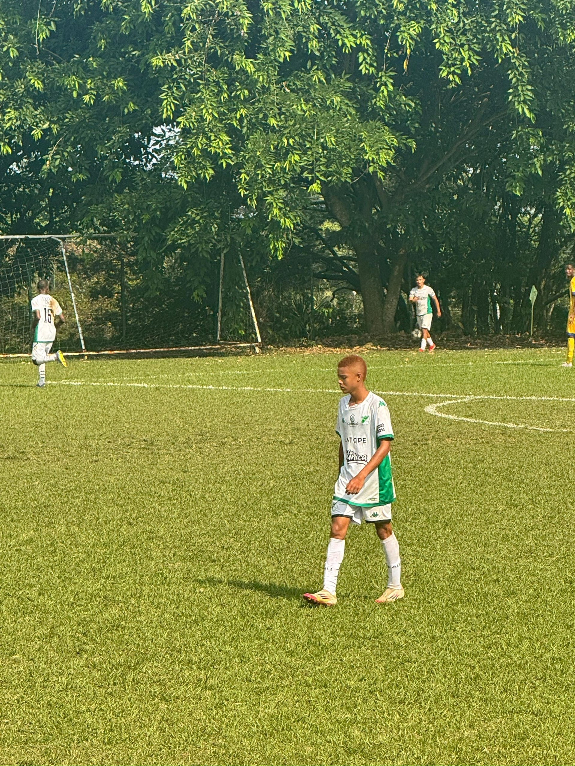 woman wearing yellow long-sleeved dress under white clouds and blue sky during daytime