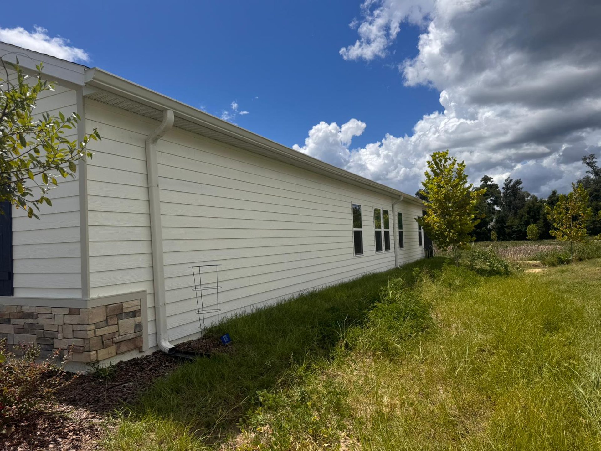 an abstract photo of a curved building with a blue sky in the background