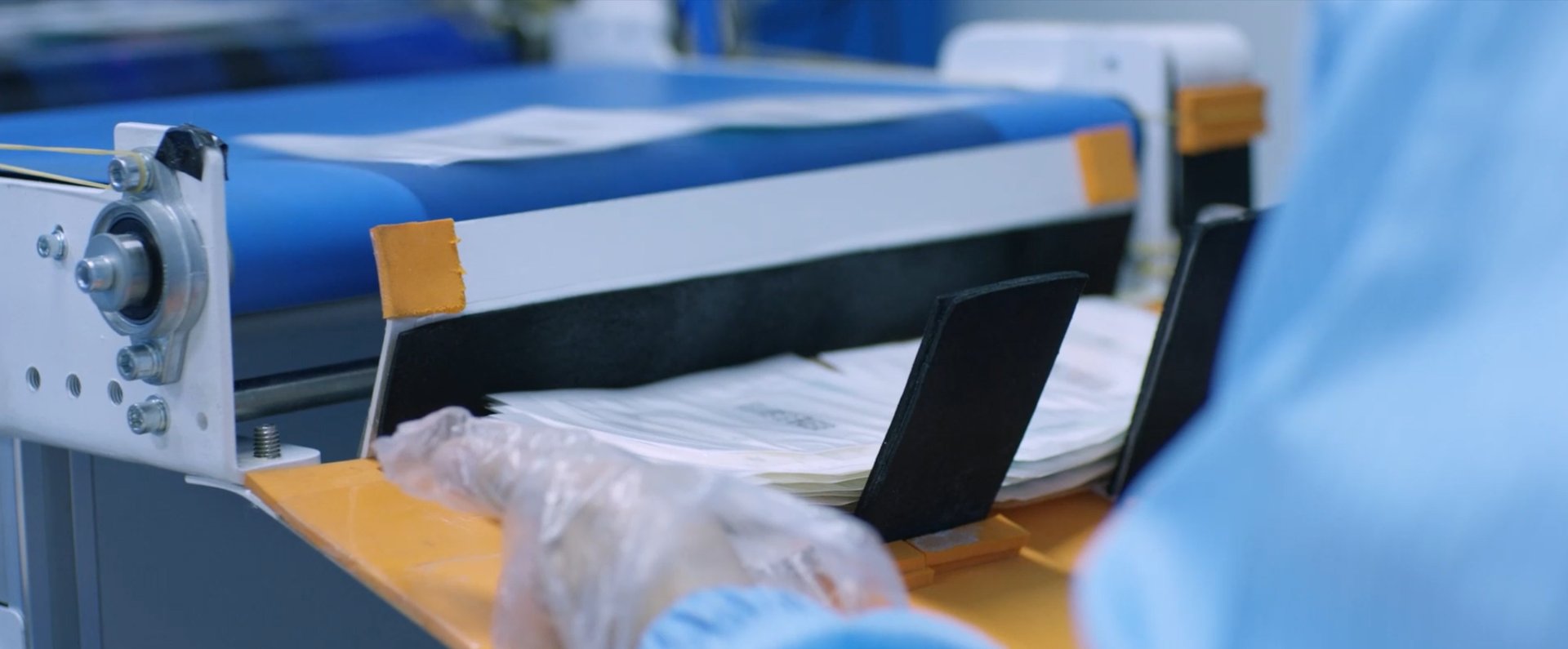 an abstract photo of a curved building with a blue sky in the background