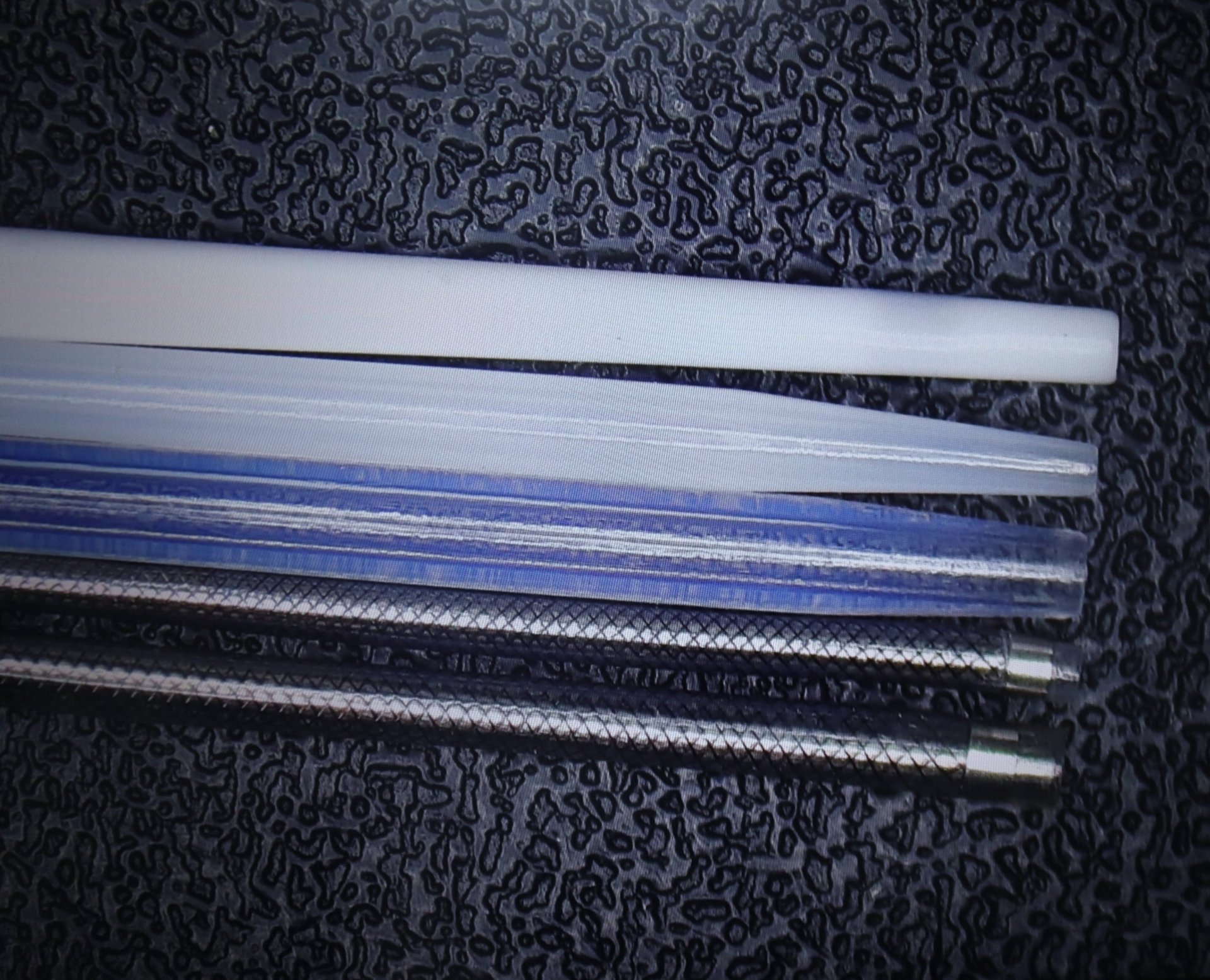 an abstract photo of a curved building with a blue sky in the background