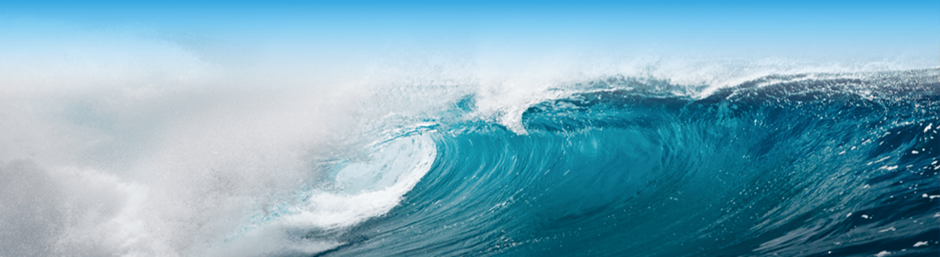 an abstract photo of a curved building with a blue sky in the background