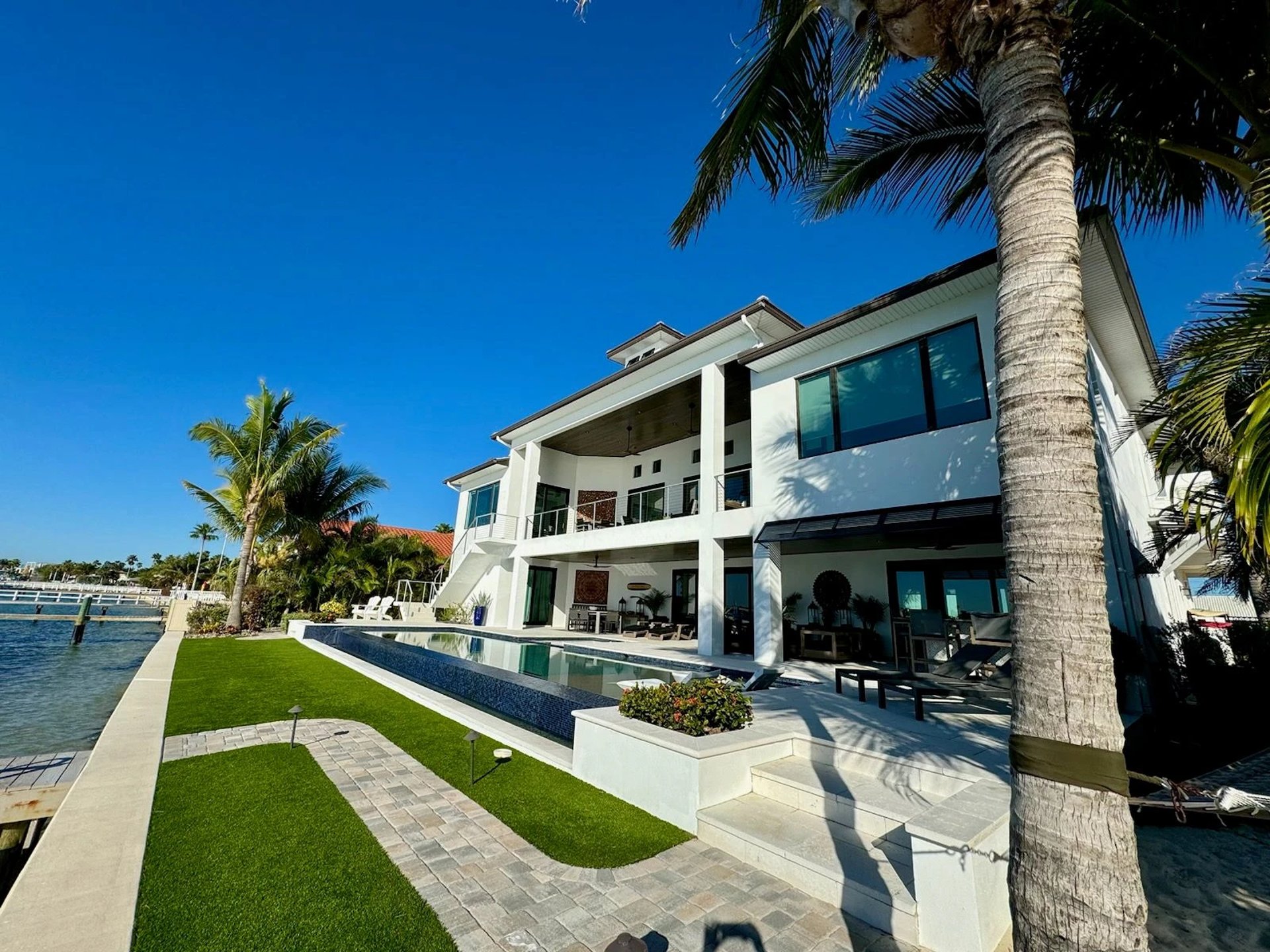 white and brown concrete building near green grass field during daytime