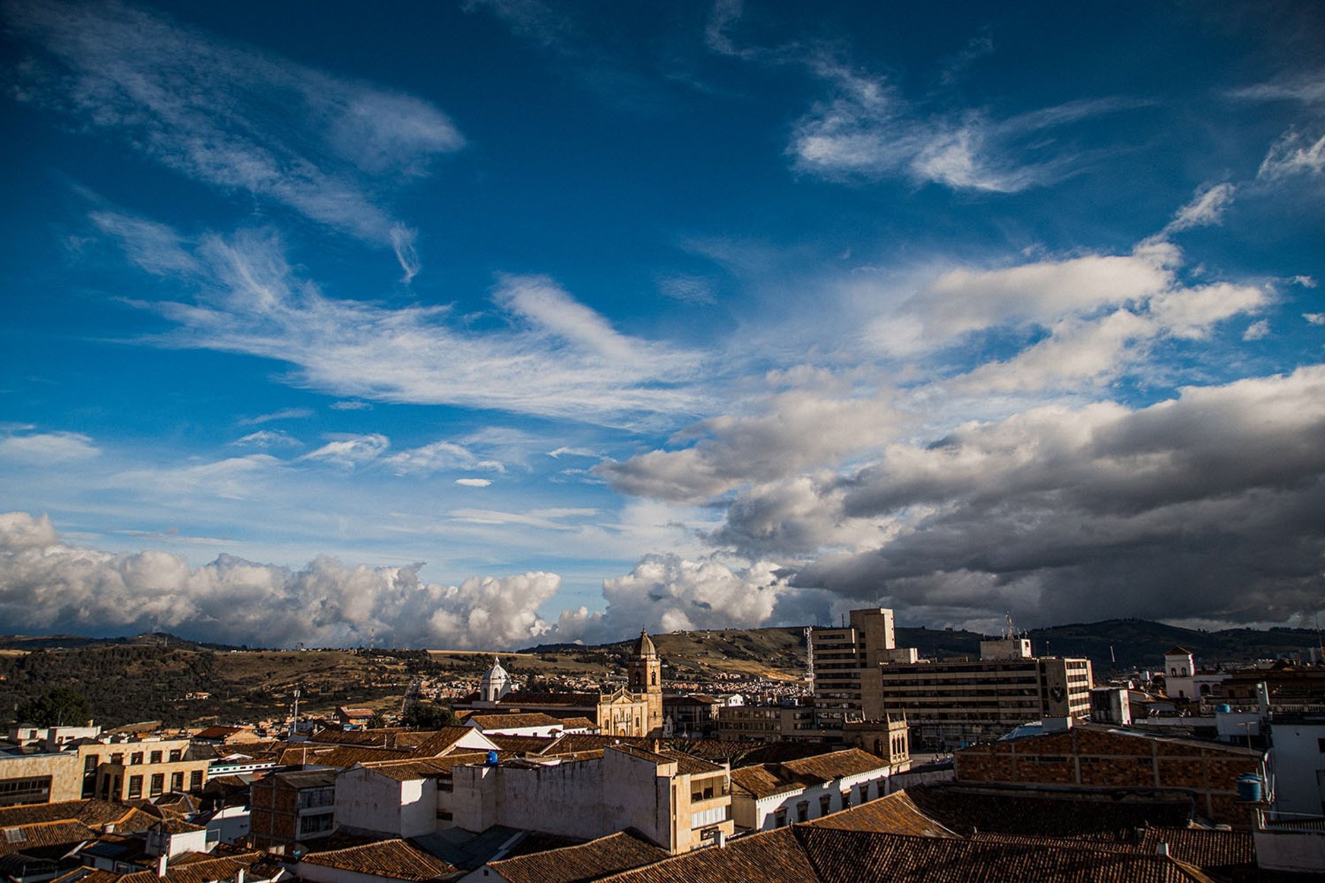 black and brown leather padded tub sofa