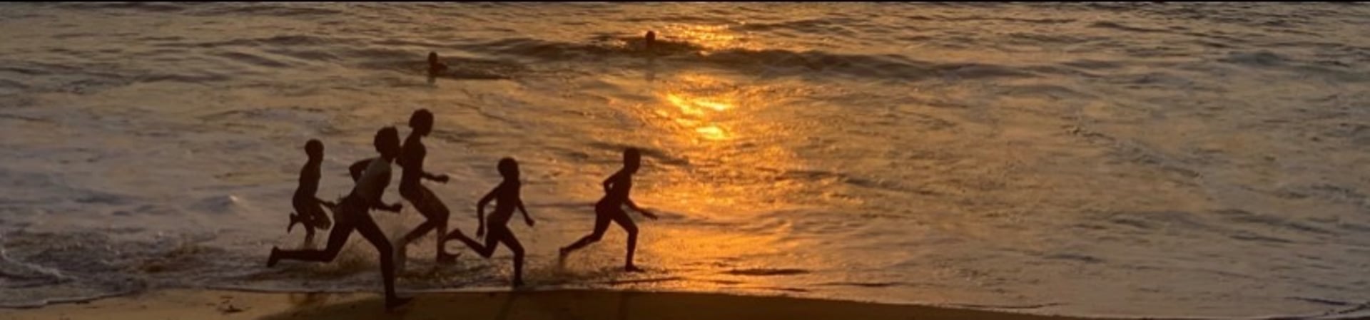 woman wearing yellow long-sleeved dress under white clouds and blue sky during daytime