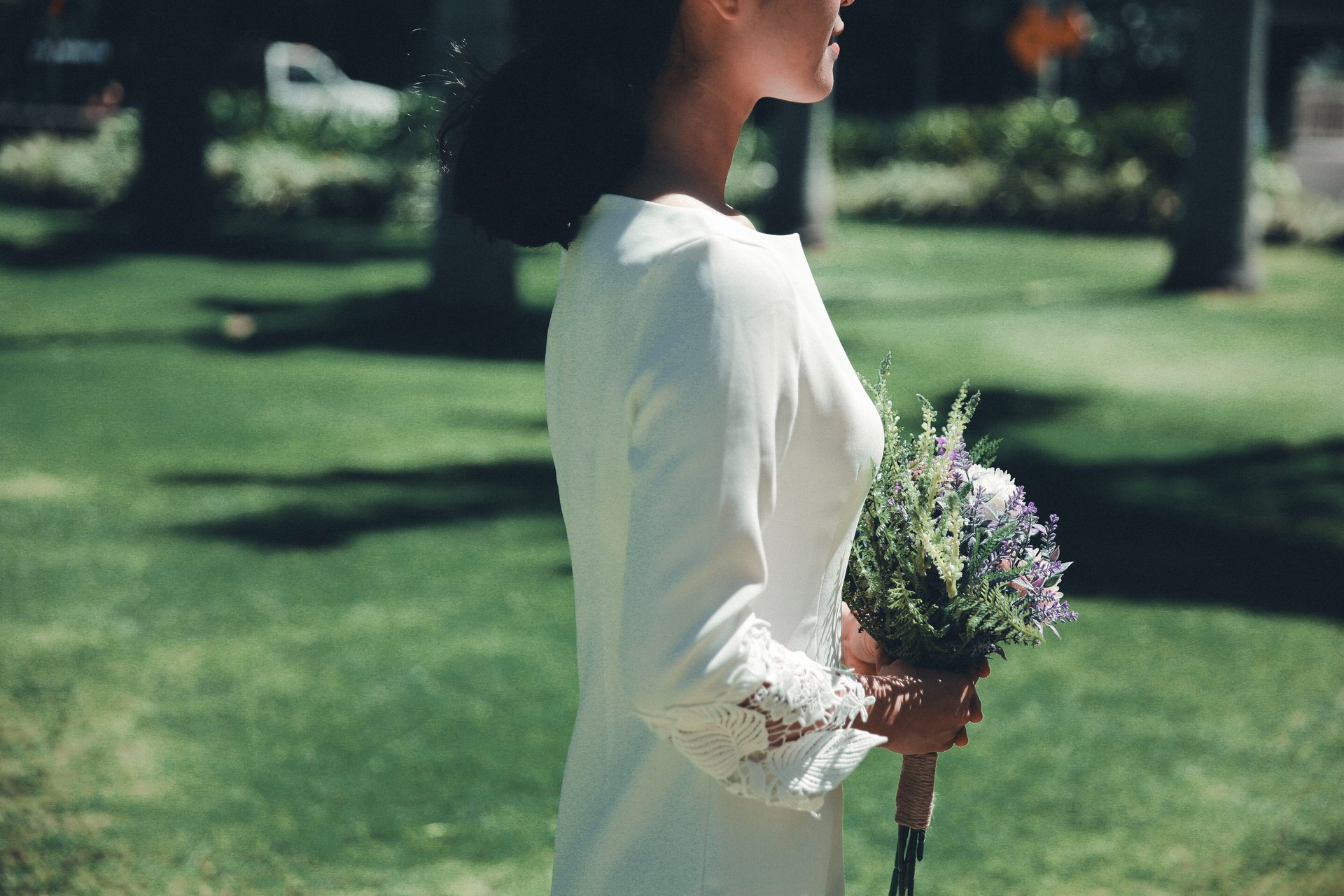 woman wearing yellow long-sleeved dress under white clouds and blue sky during daytime