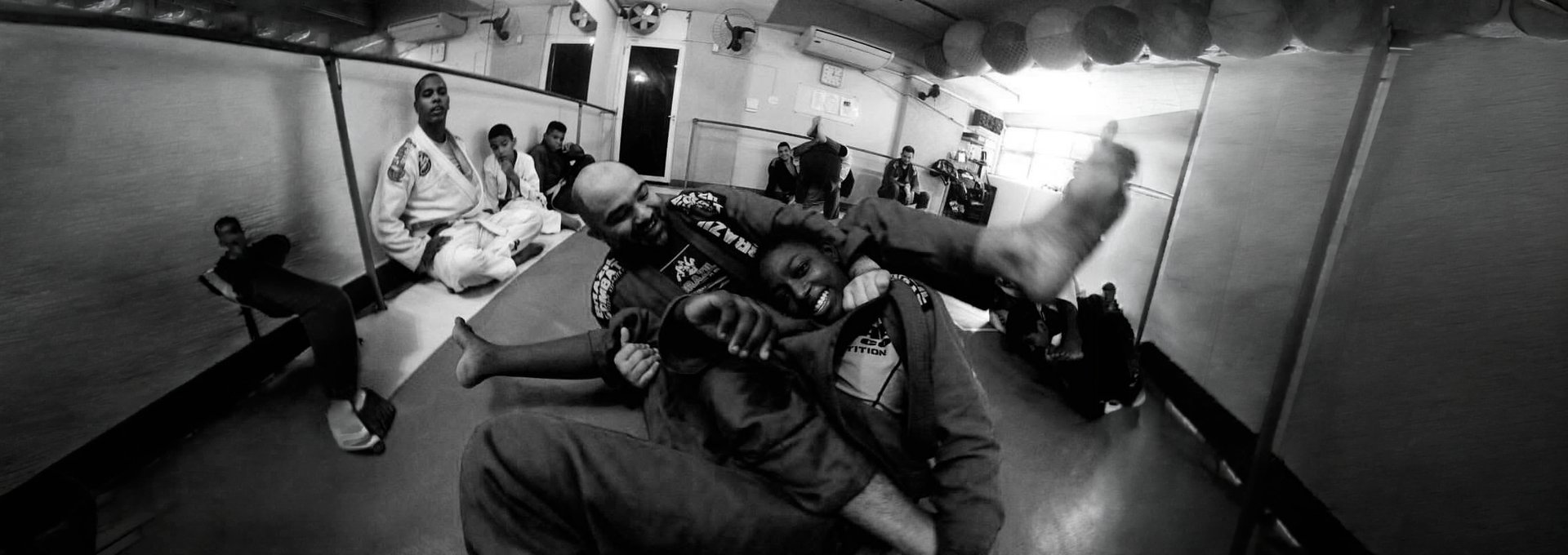 Two people grappling in a martial arts match.