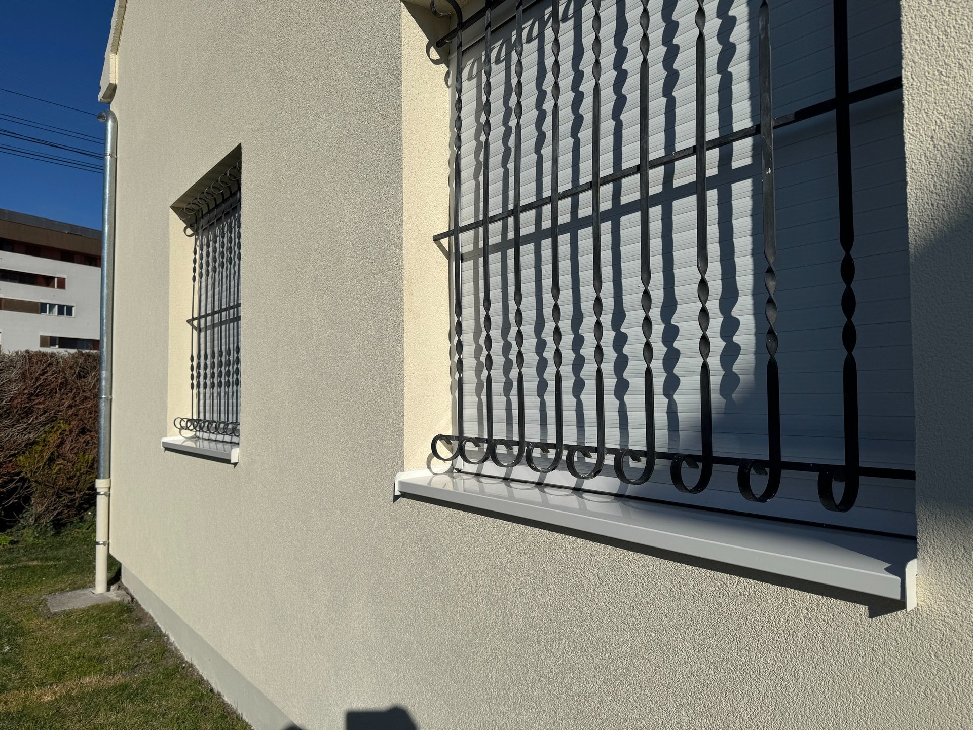 an abstract photo of a curved building with a blue sky in the background
