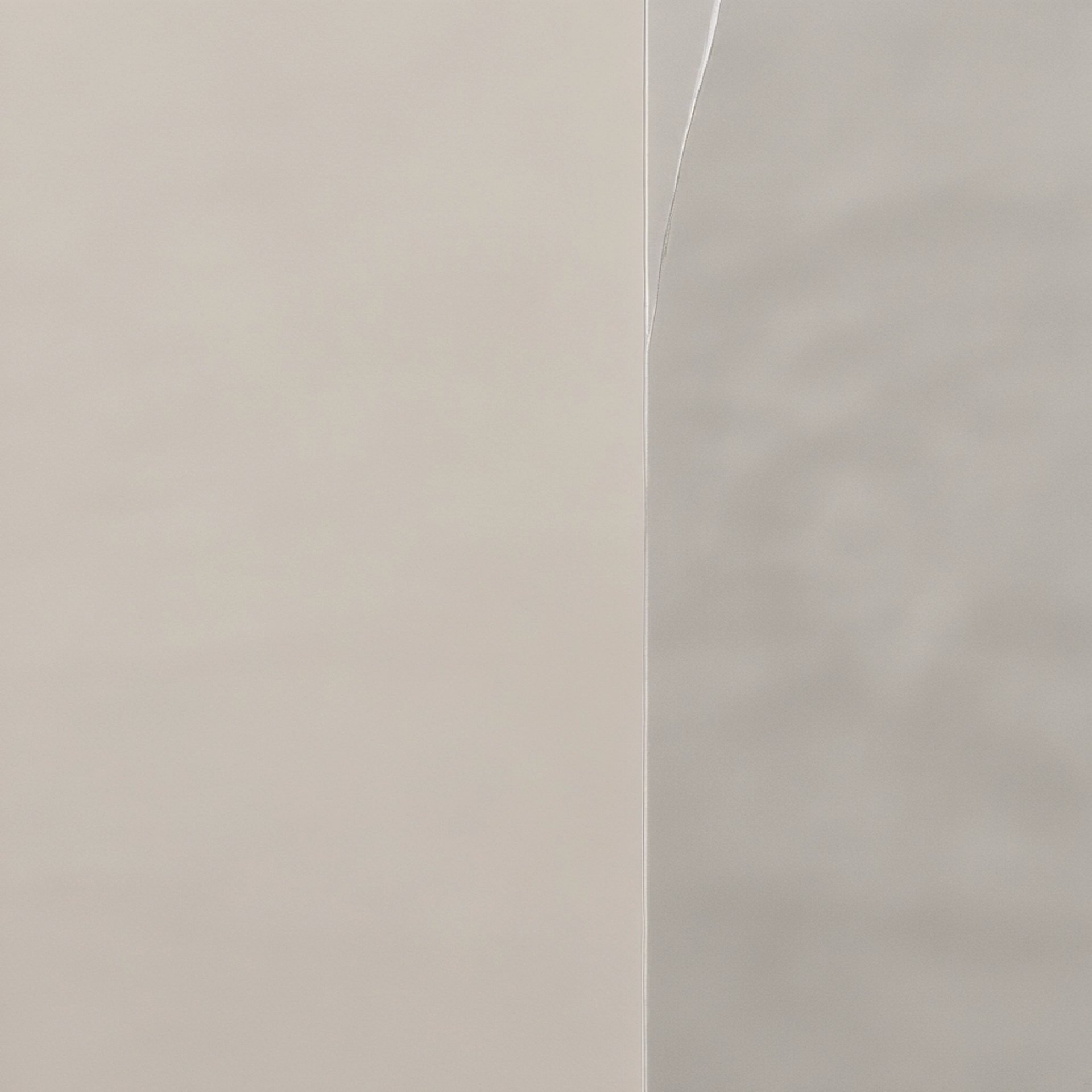 an abstract photo of a curved building with a blue sky in the background