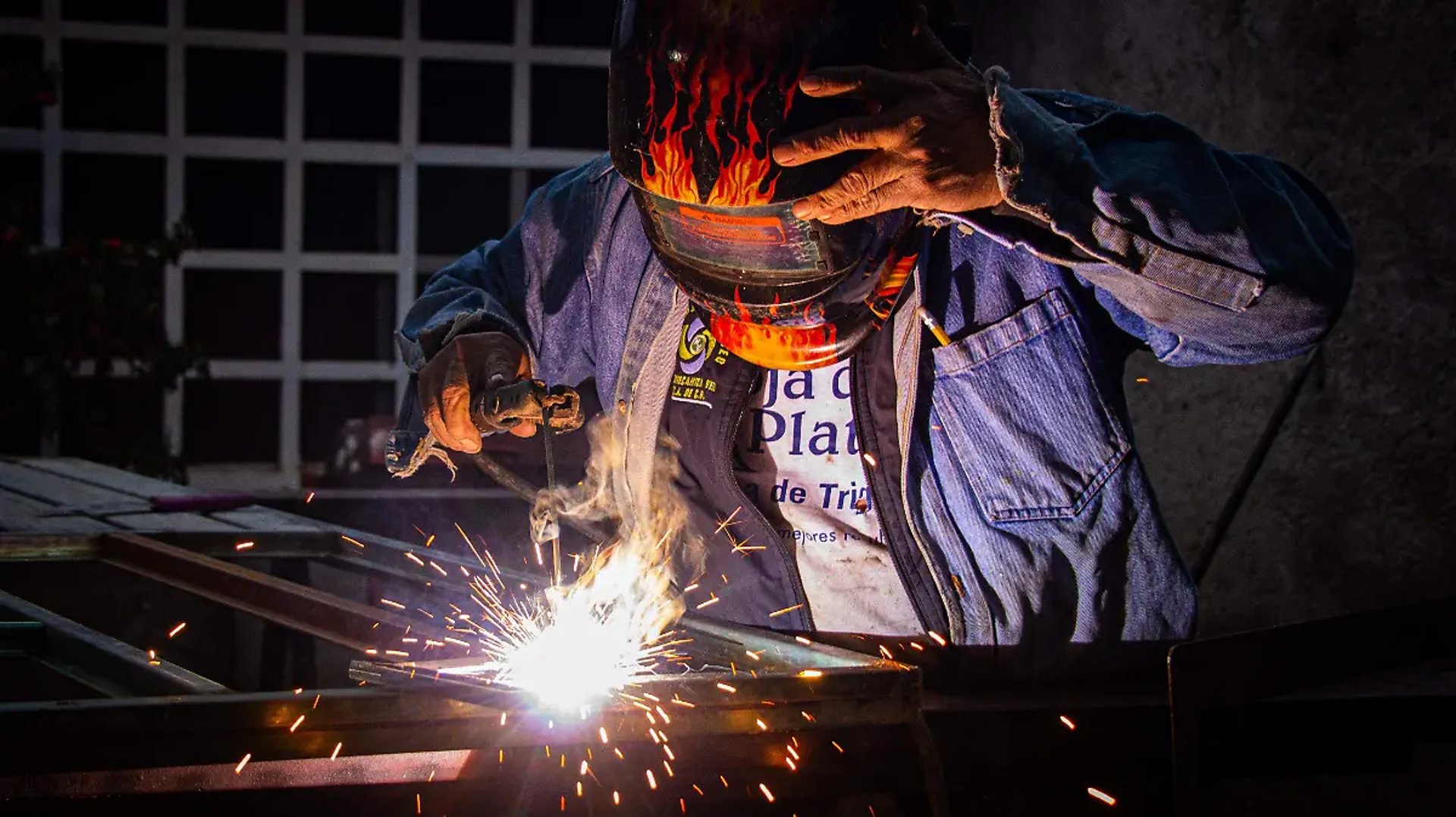 an abstract photo of a curved building with a blue sky in the background