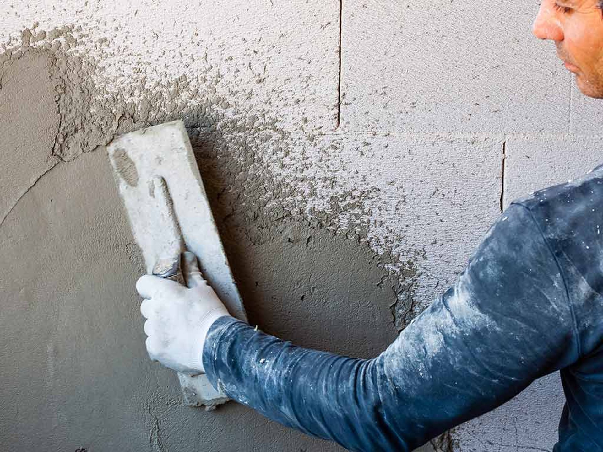 an abstract photo of a curved building with a blue sky in the background