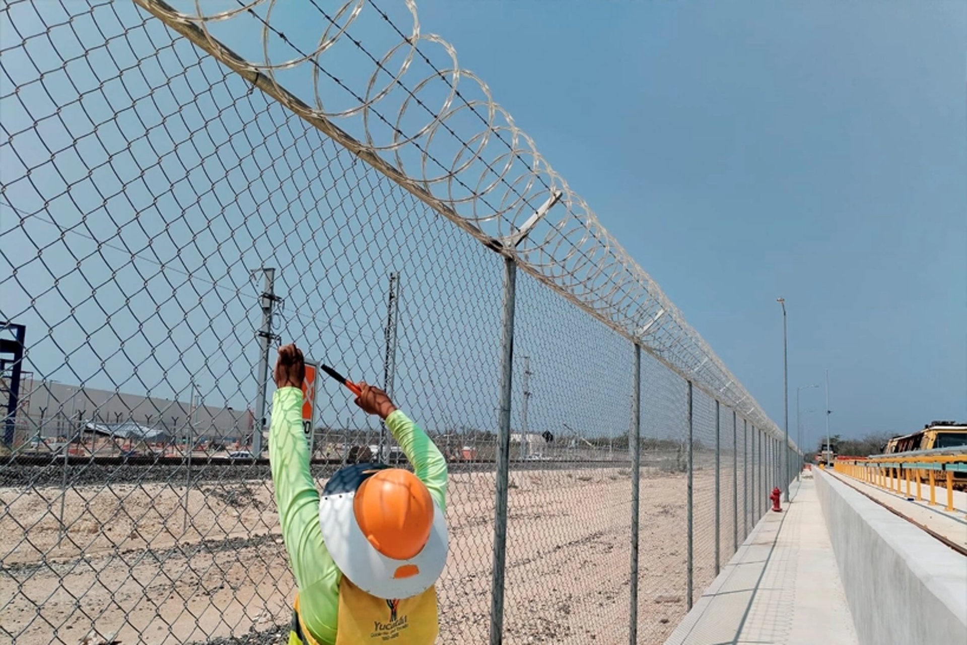 an abstract photo of a curved building with a blue sky in the background