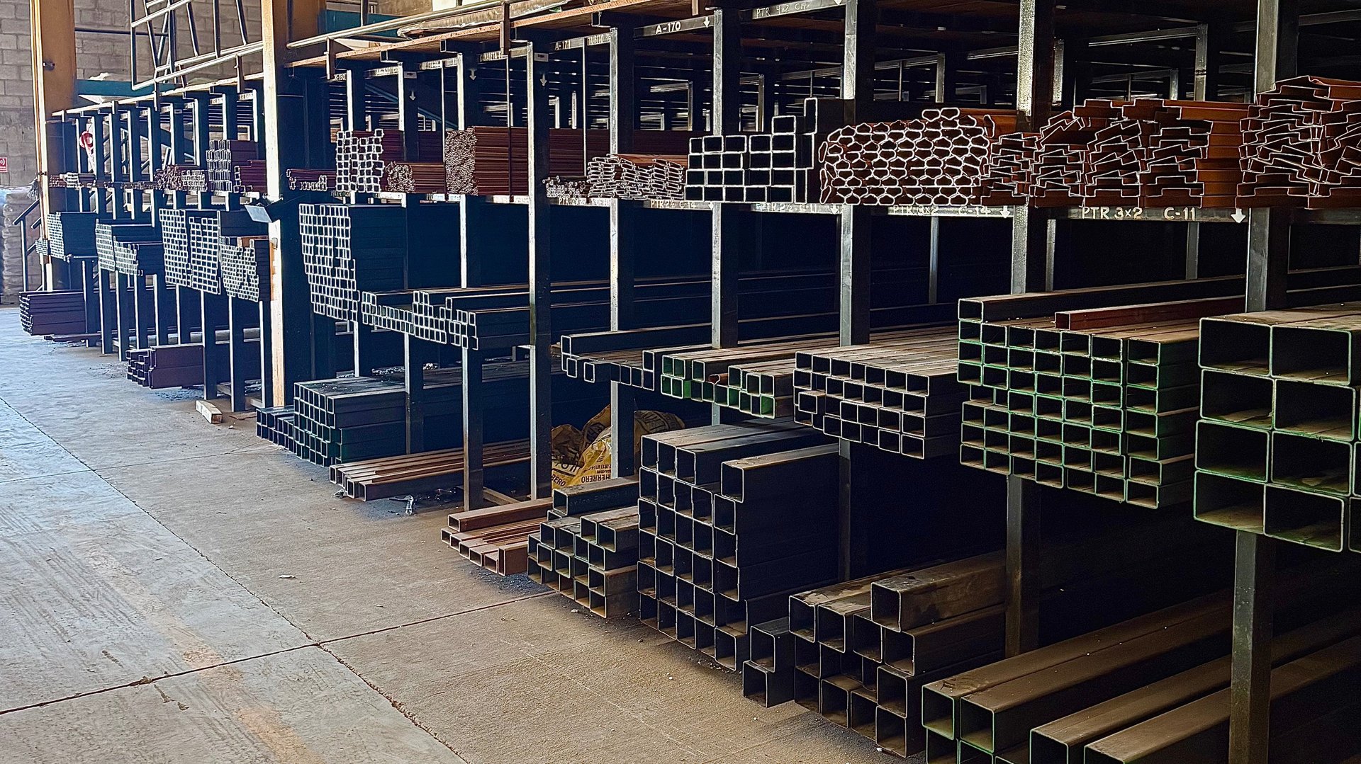 an abstract photo of a curved building with a blue sky in the background