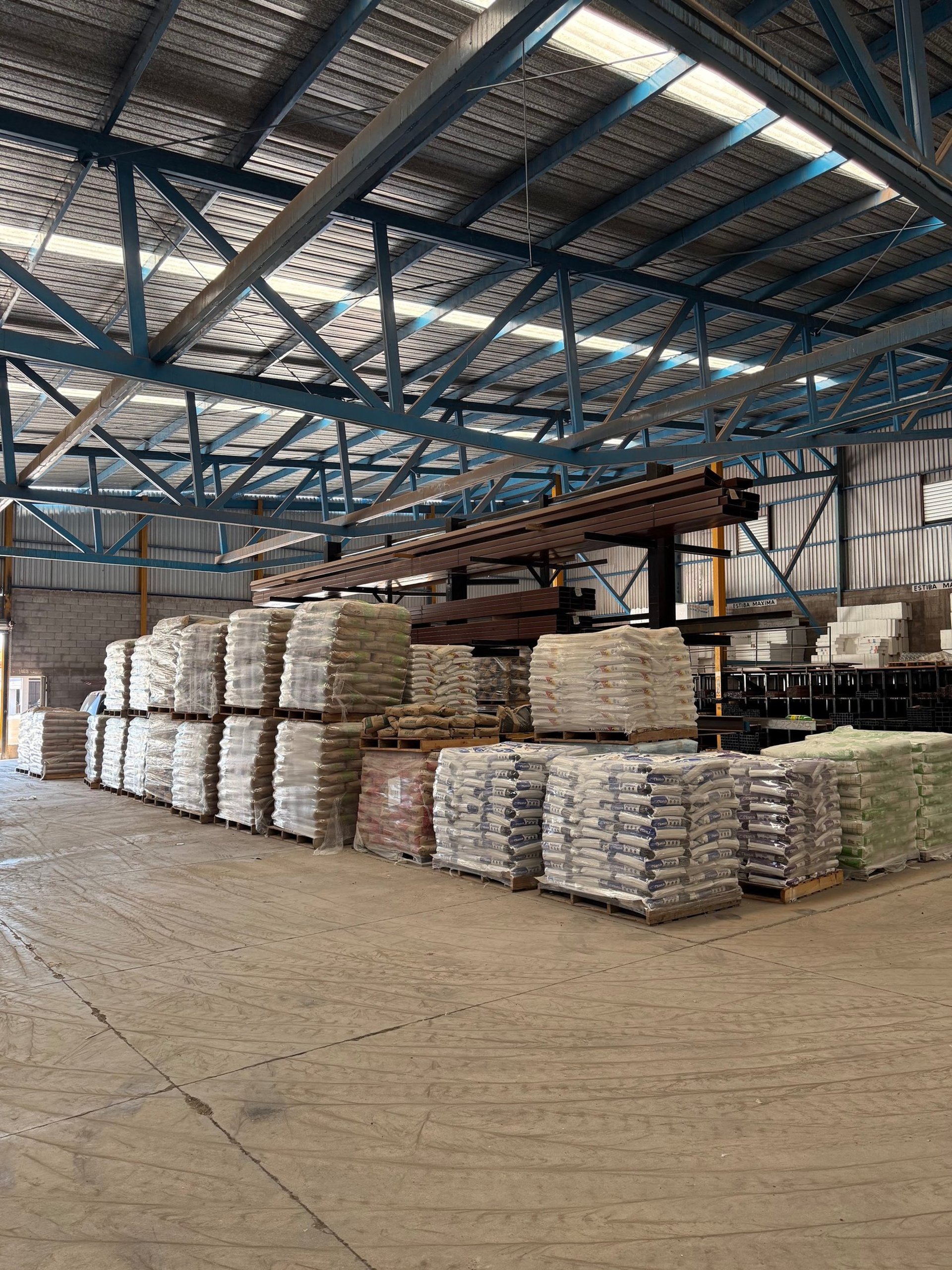 an abstract photo of a curved building with a blue sky in the background
