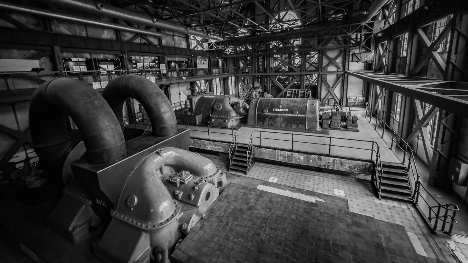 an abstract photo of a curved building with a blue sky in the background