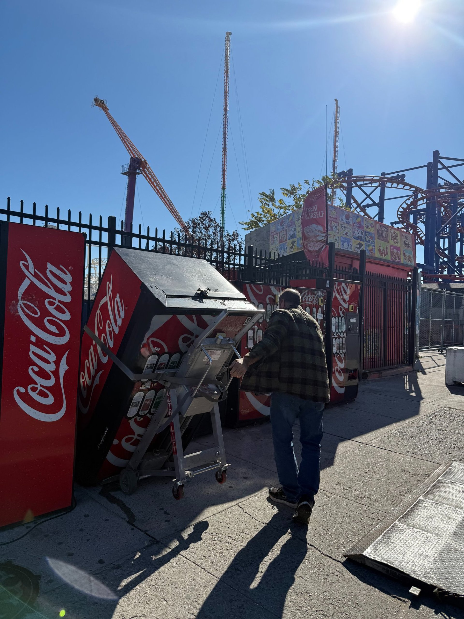 an abstract photo of a curved building with a blue sky in the background
