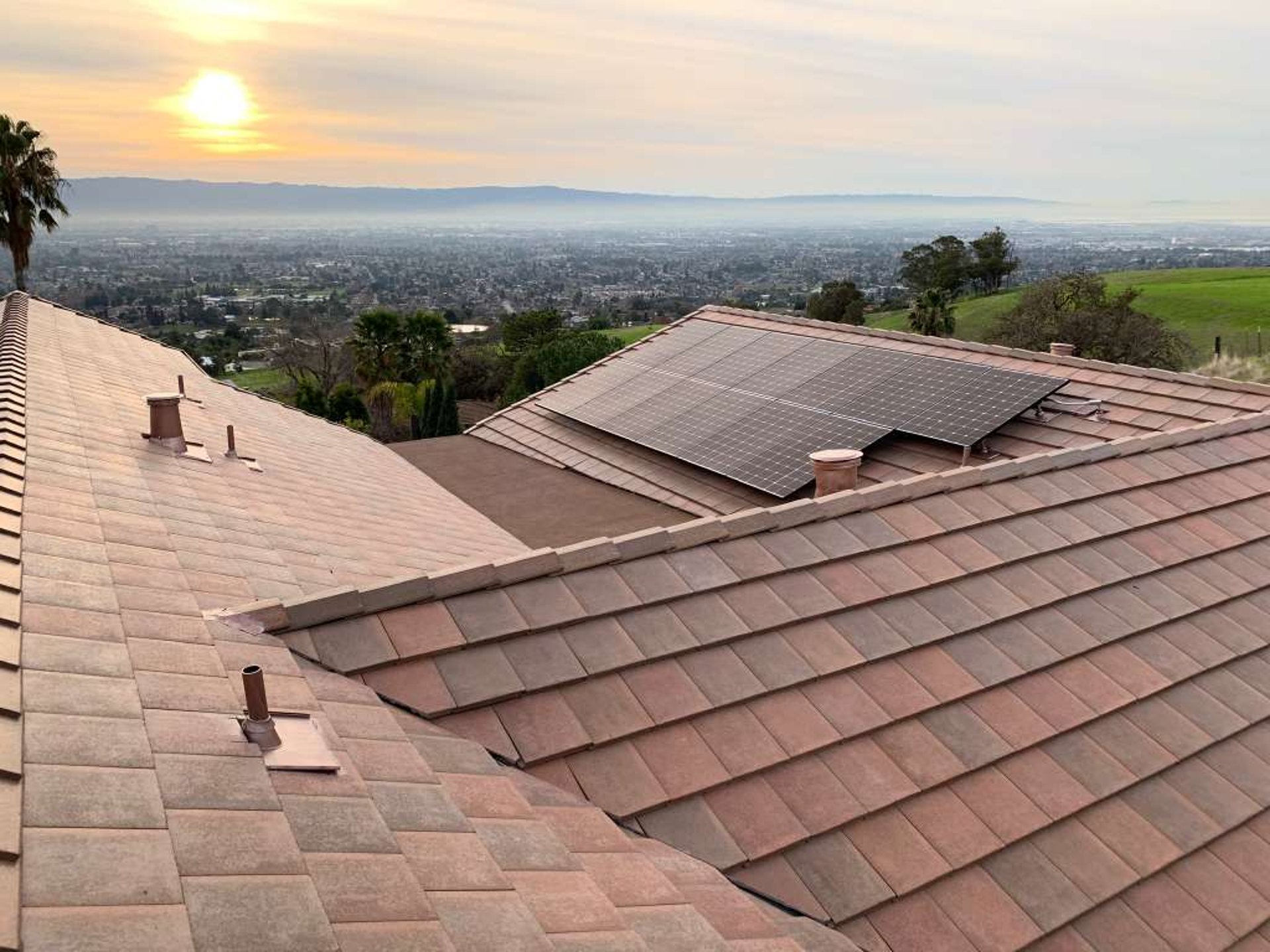 Beautiful white house with palm trees in the background.