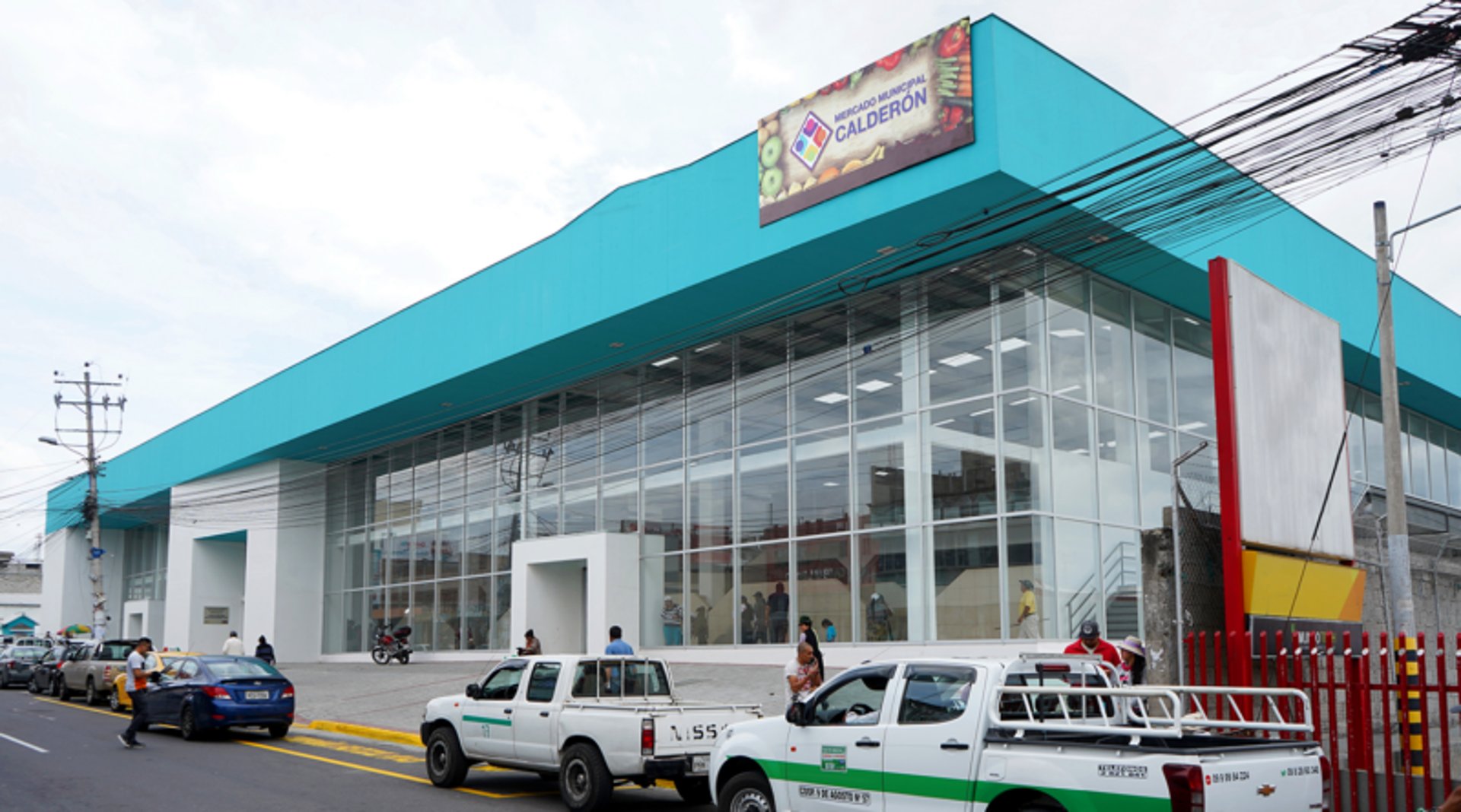 an abstract photo of a curved building with a blue sky in the background