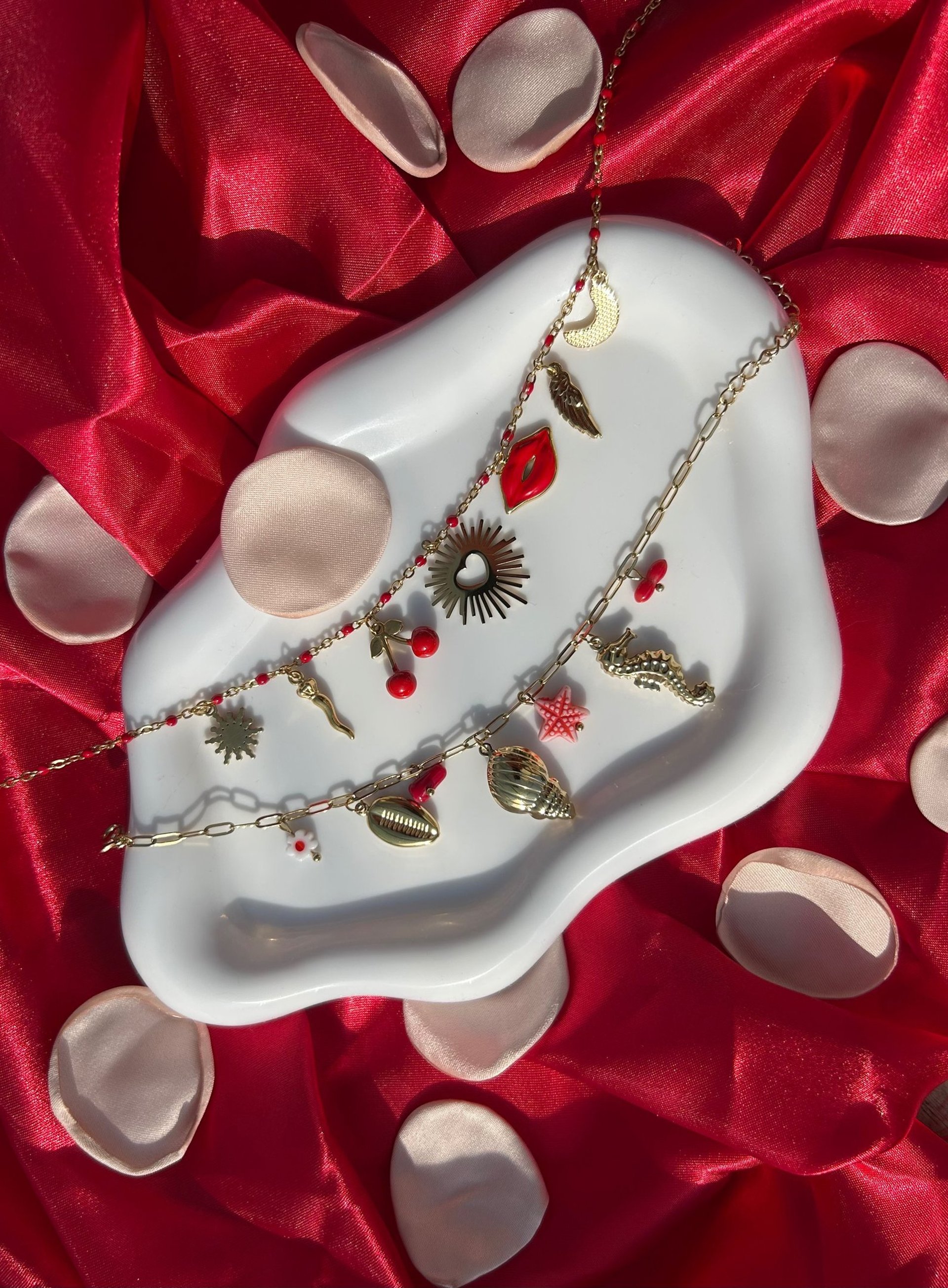 woman in white v neck shirt wearing gold necklace