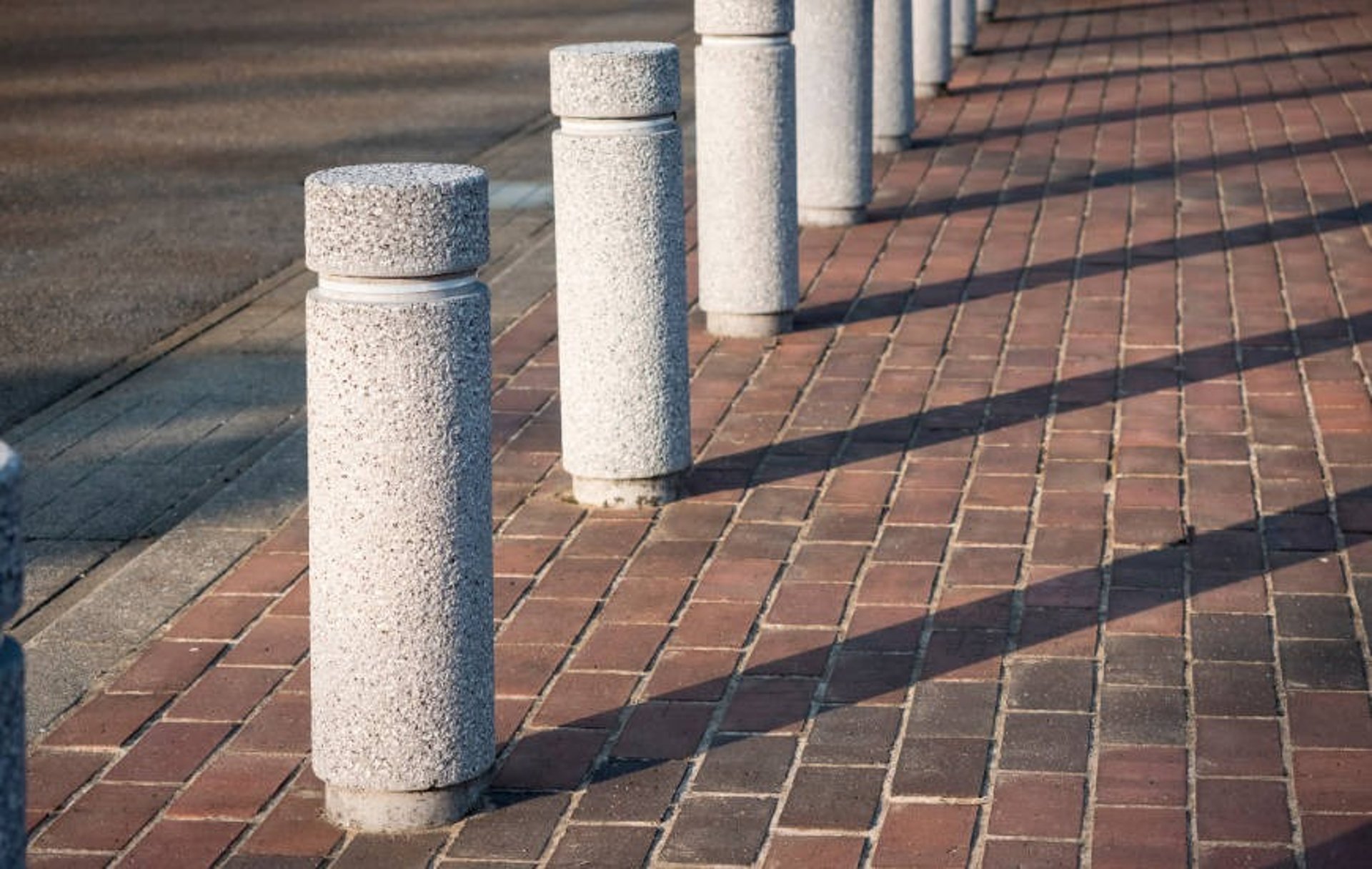 an abstract photo of a curved building with a blue sky in the background