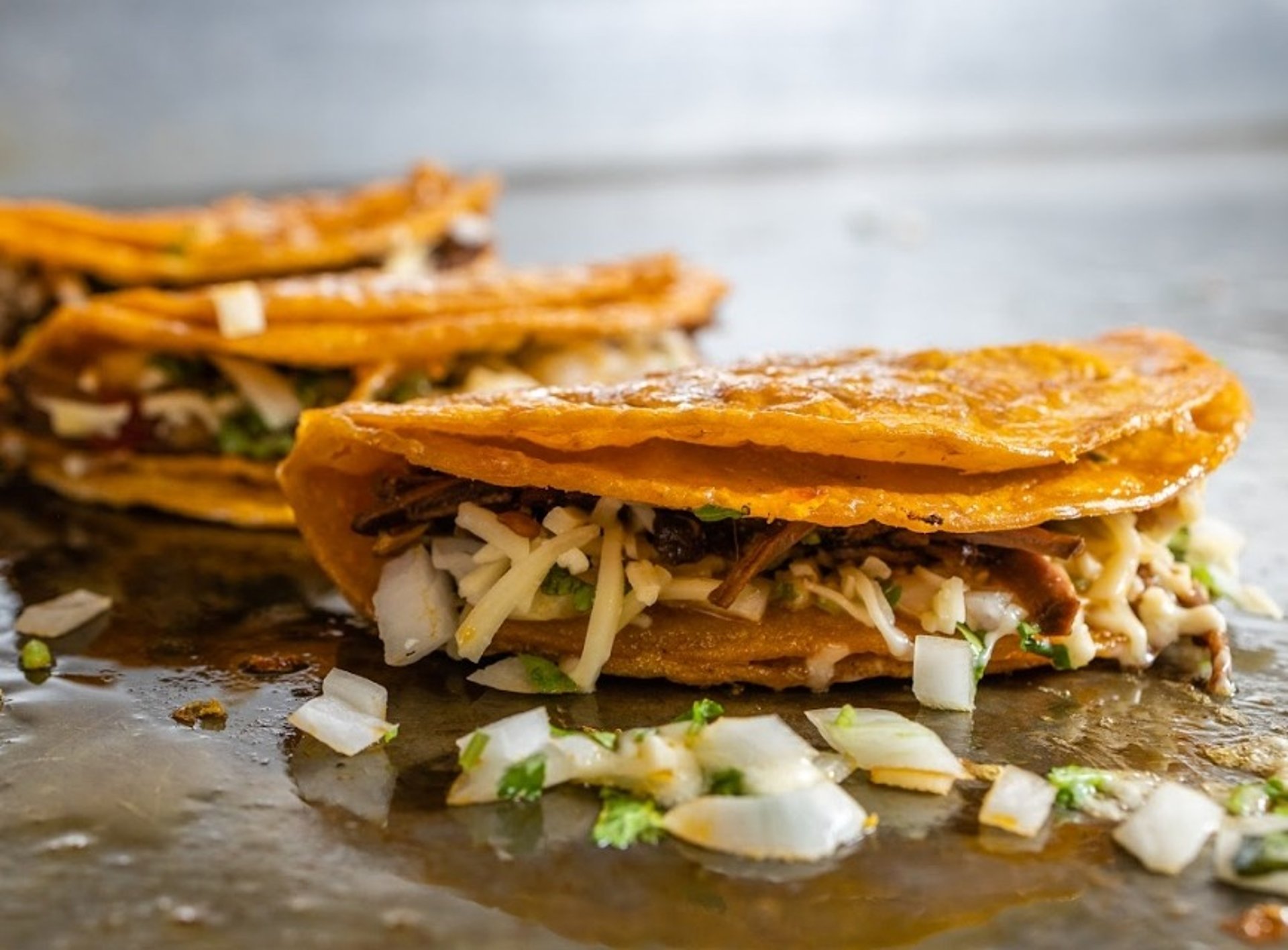 woman wearing yellow long-sleeved dress under white clouds and blue sky during daytime