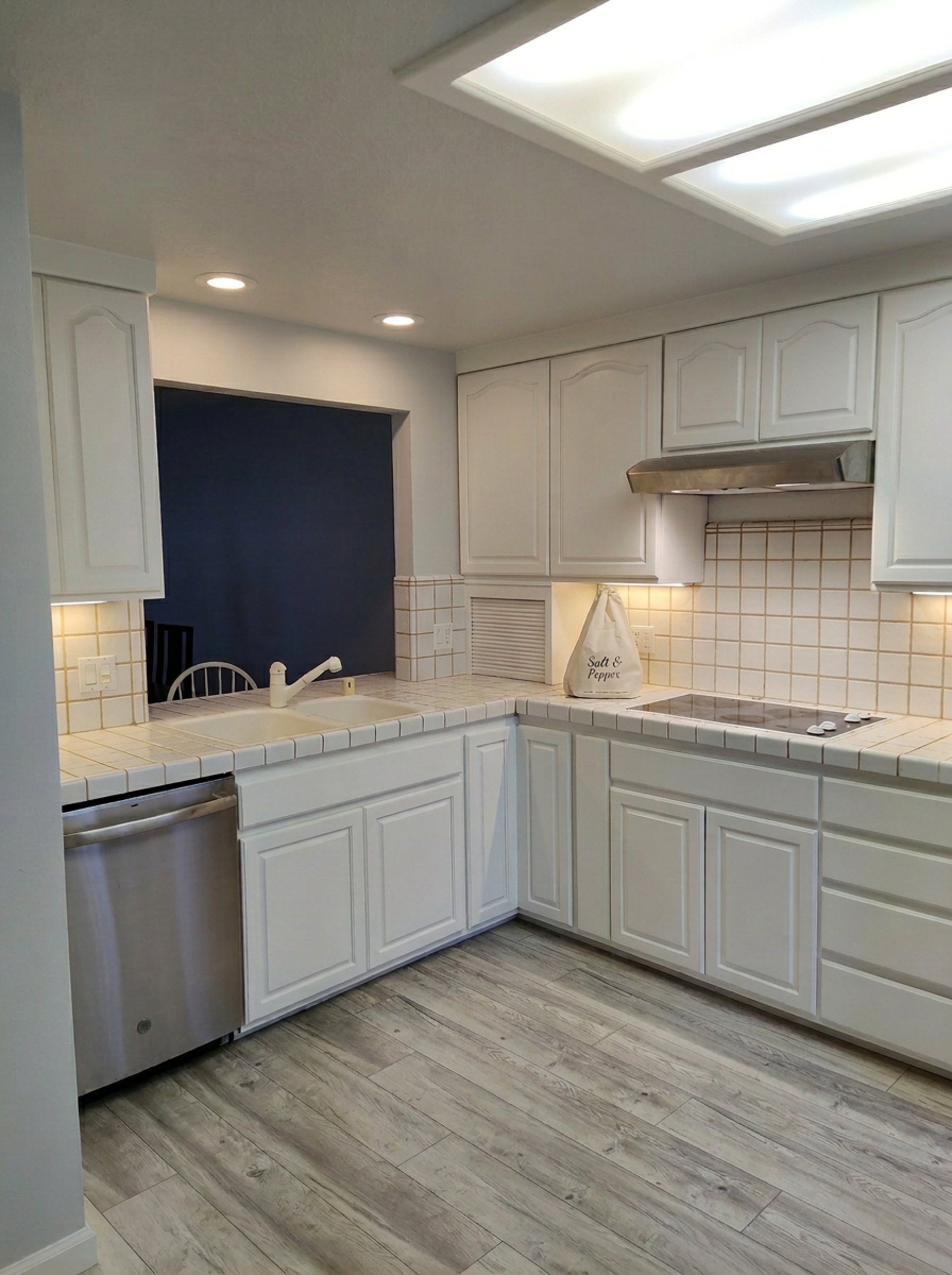 a bedroom with a bed, dresser and mirror