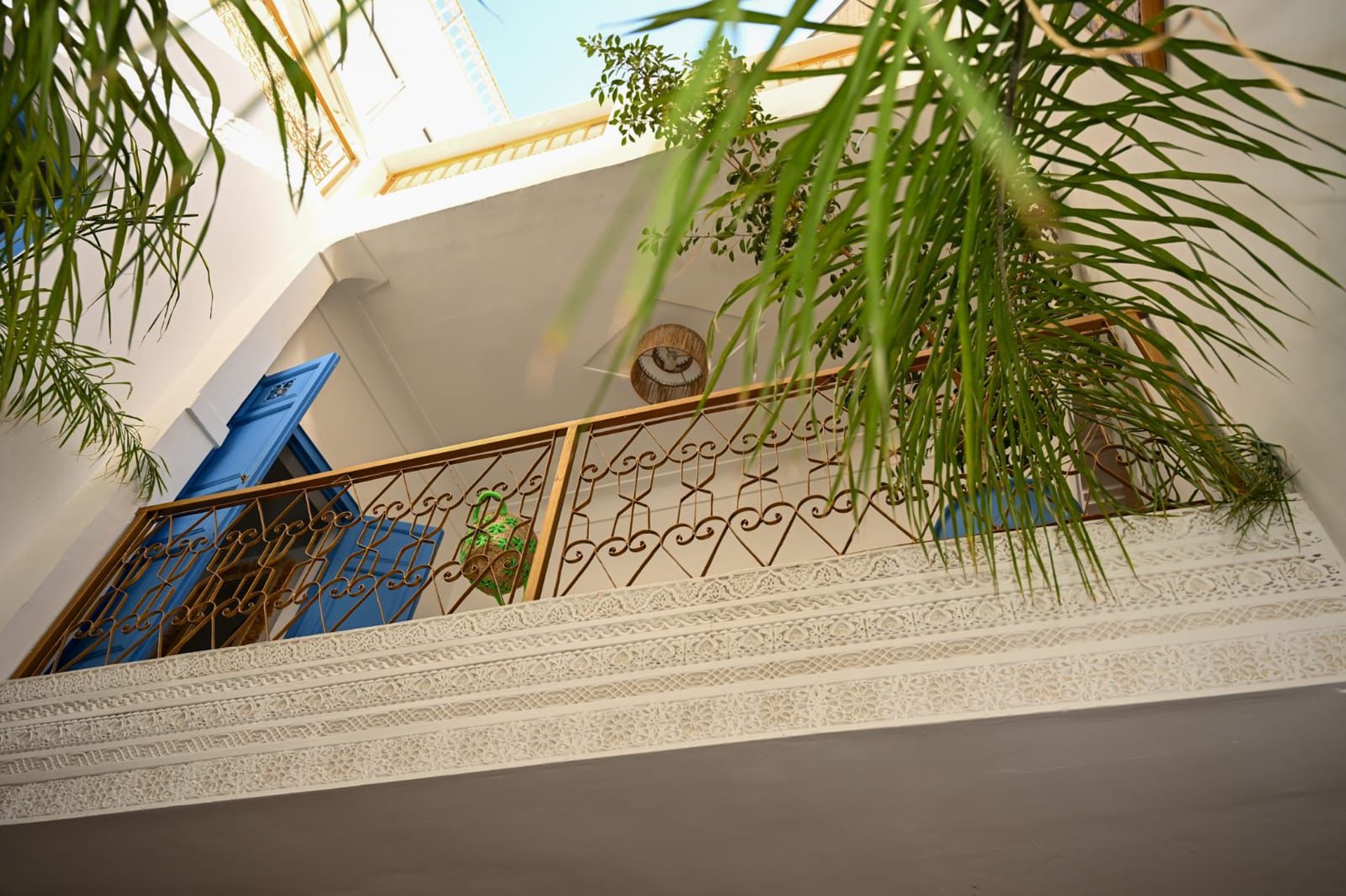 an abstract photo of a curved building with a blue sky in the background