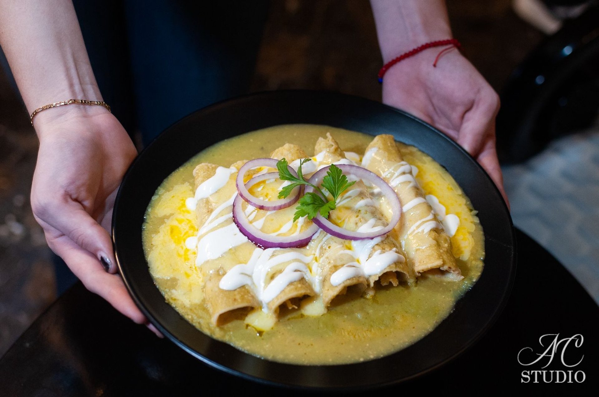 woman wearing yellow long-sleeved dress under white clouds and blue sky during daytime