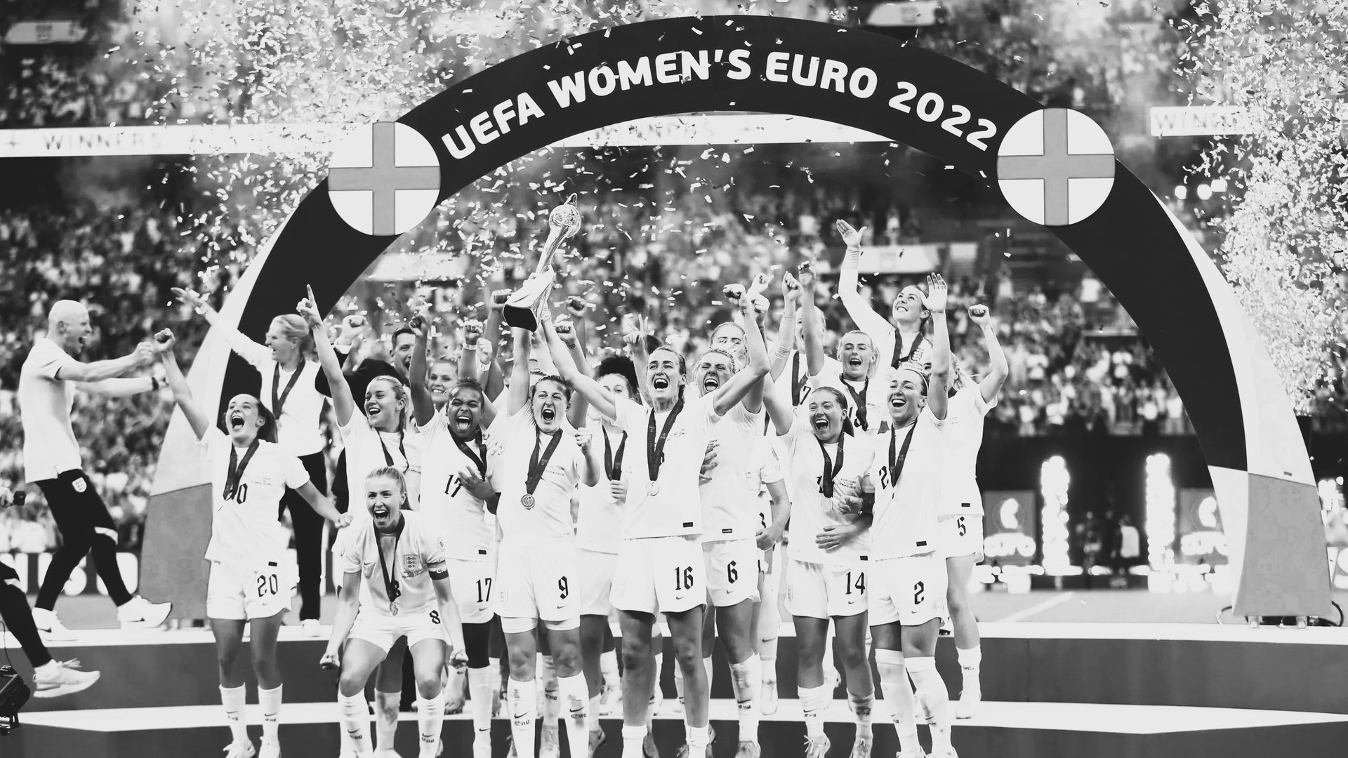 An orchestra performs for a large, attentive audience.