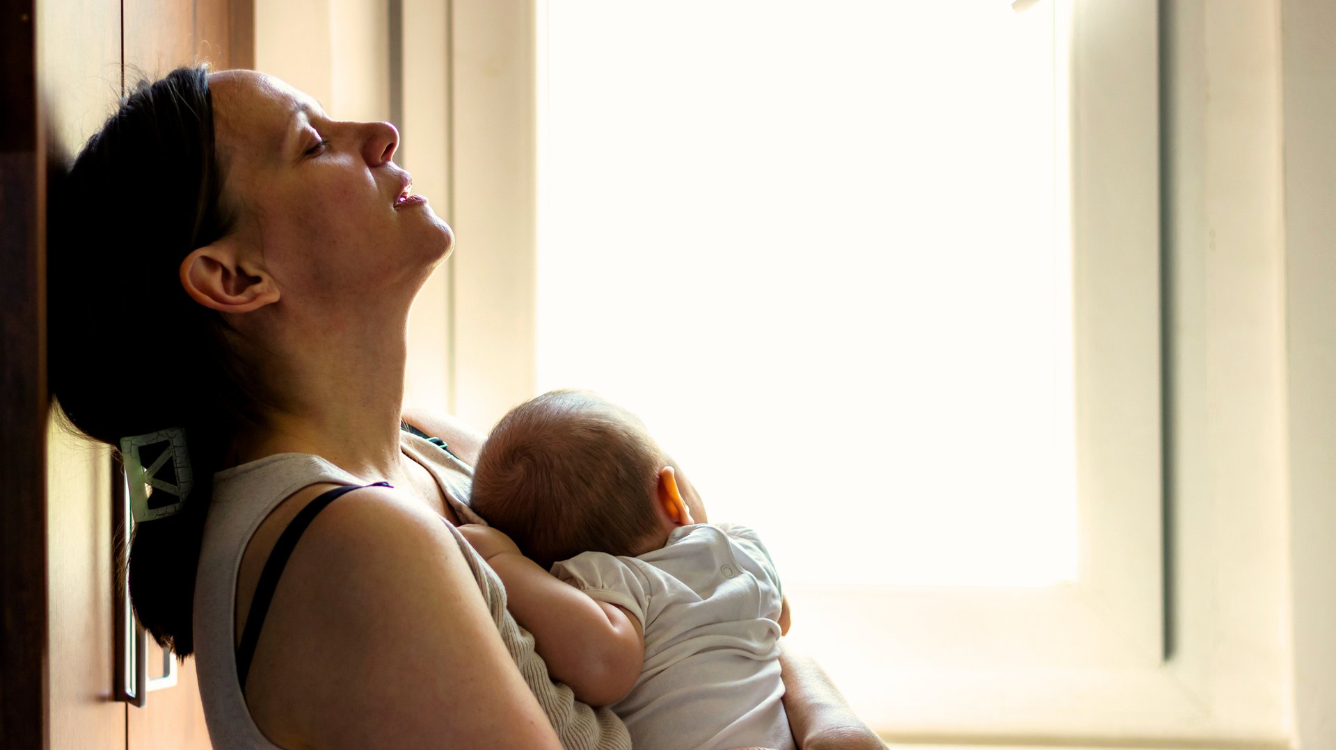 an abstract photo of a curved building with a blue sky in the background