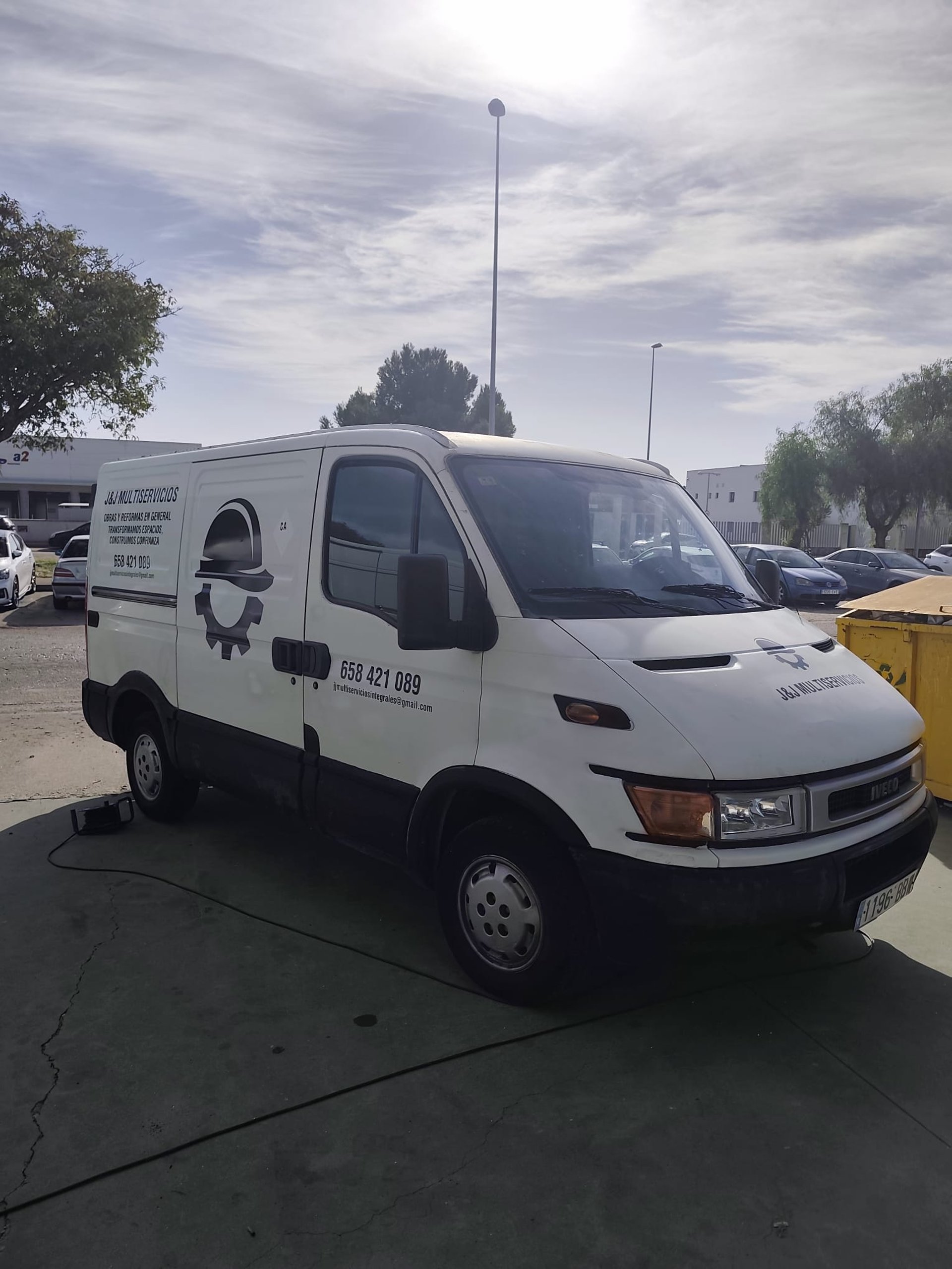 woman wearing yellow long-sleeved dress under white clouds and blue sky during daytime