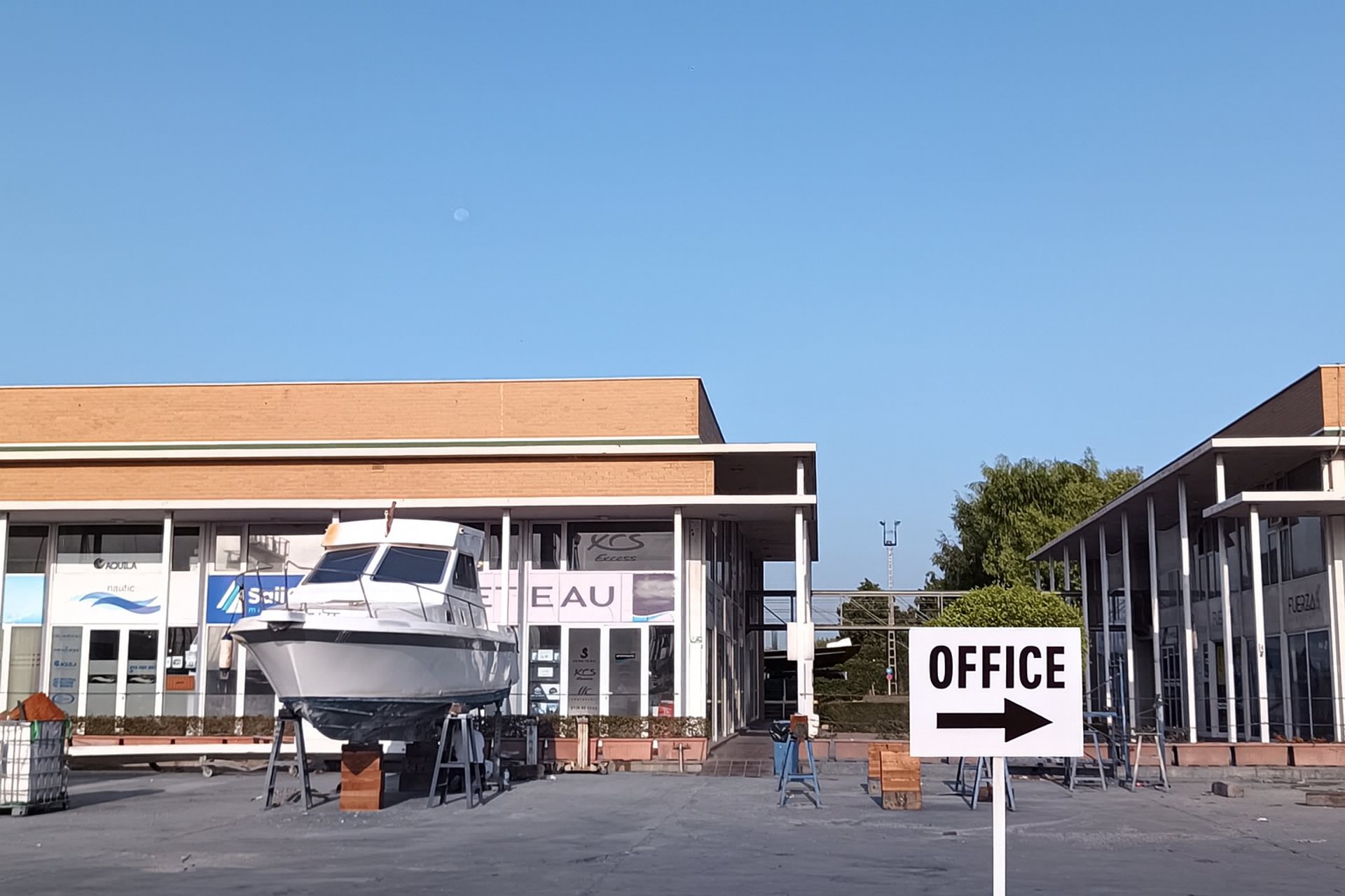 an abstract photo of a curved building with a blue sky in the background