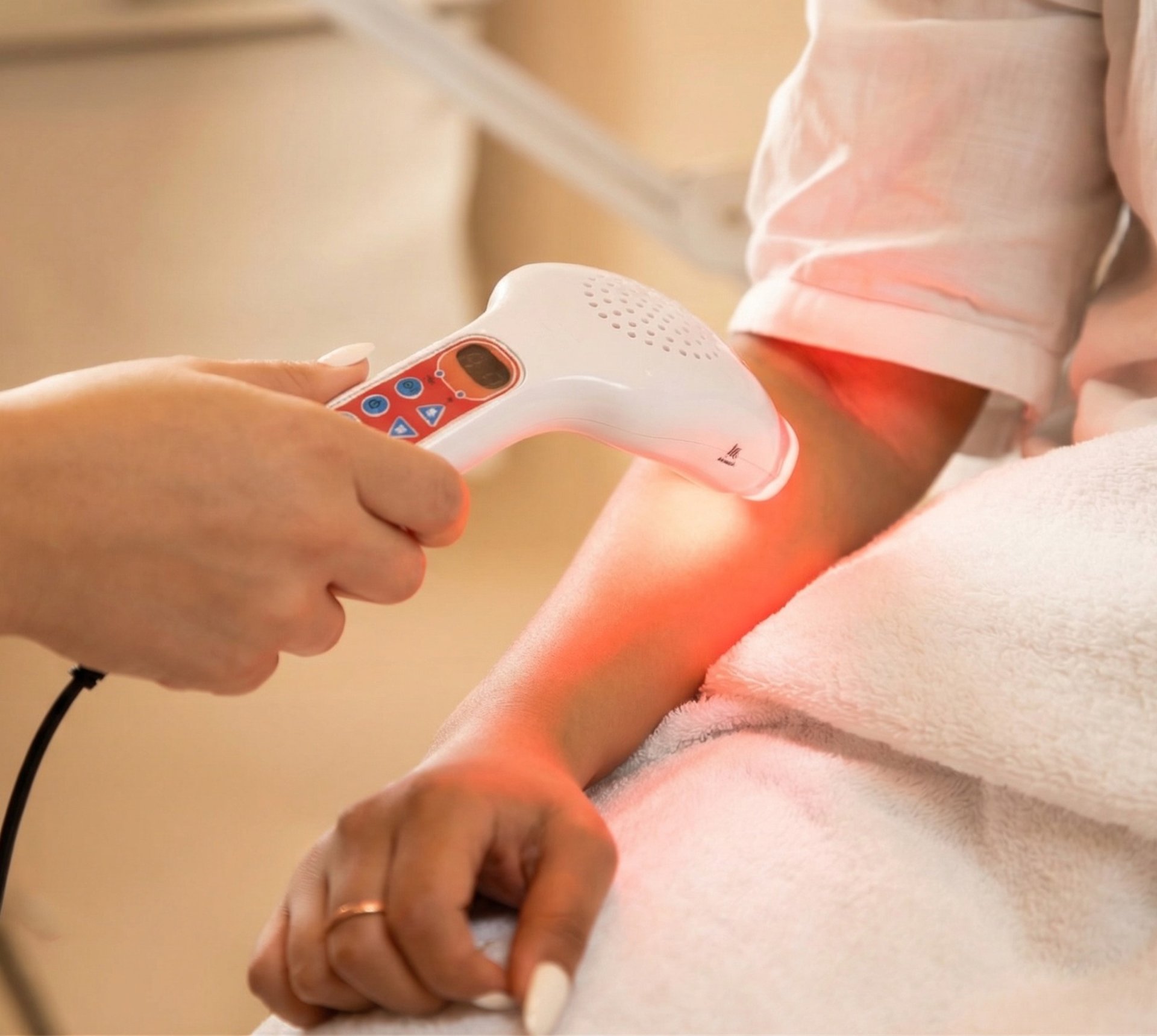 a woman getting her nails done at a nail salon