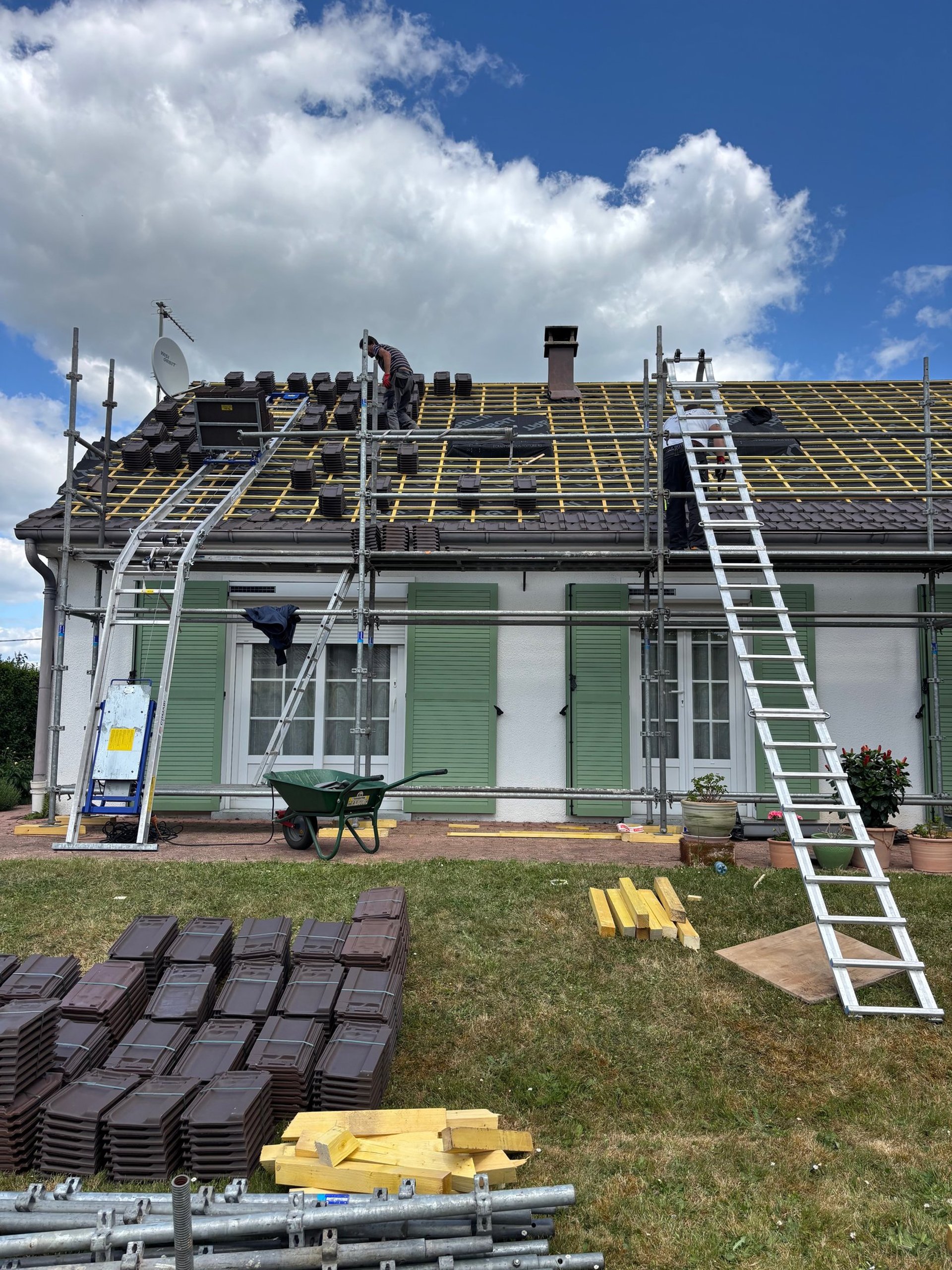 woman wearing yellow long-sleeved dress under white clouds and blue sky during daytime