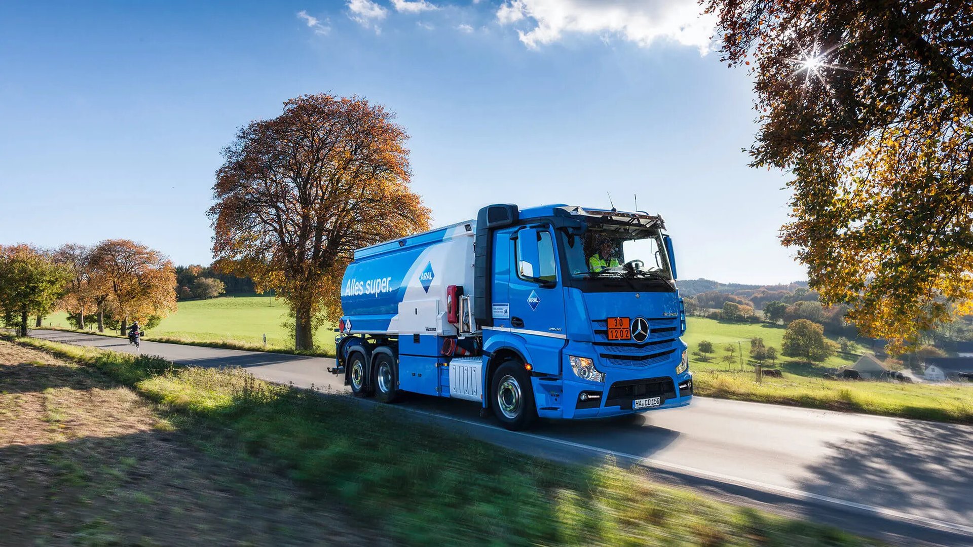 A man sanding a wooden table with a sander