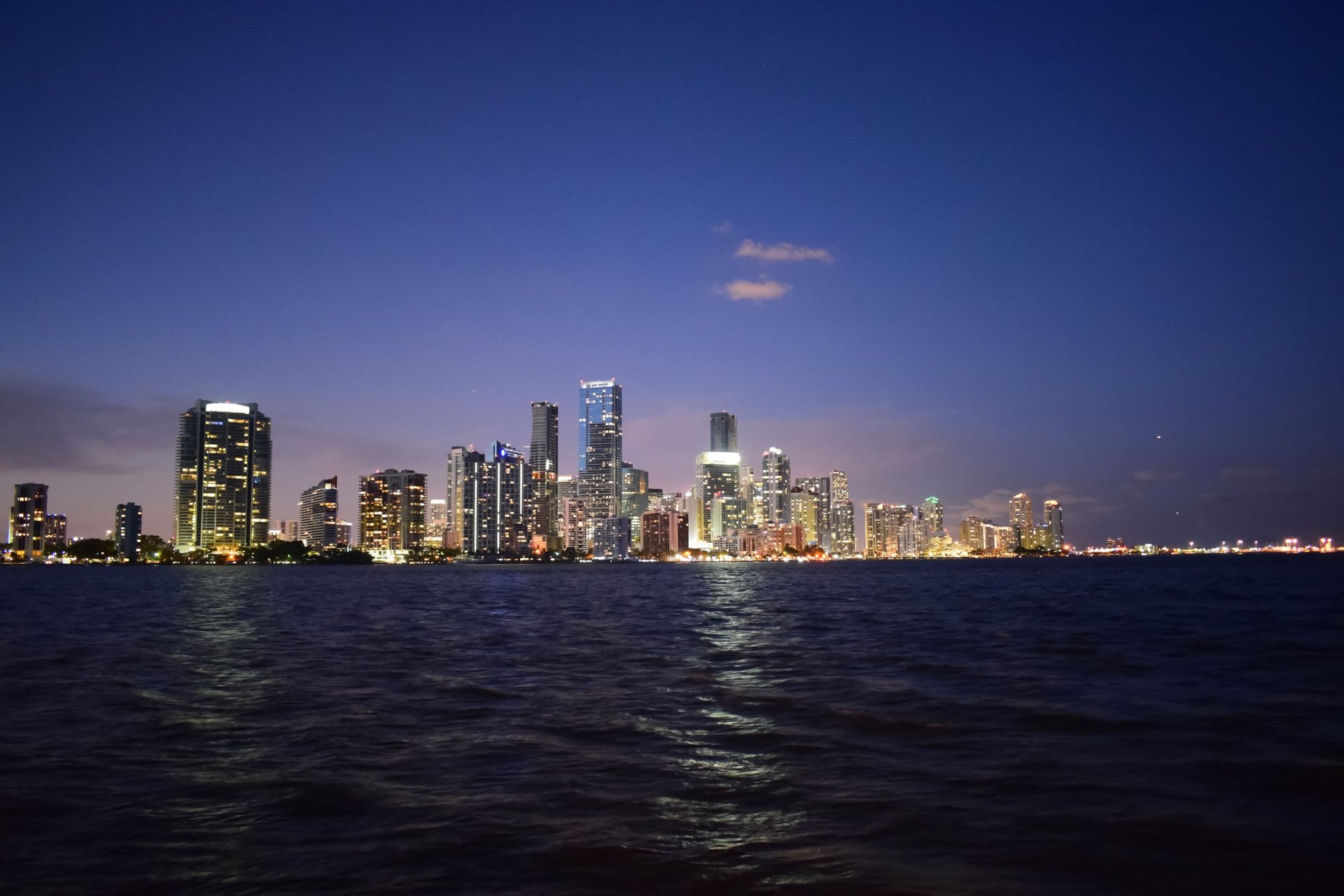 body of water near of city high-rise buildings