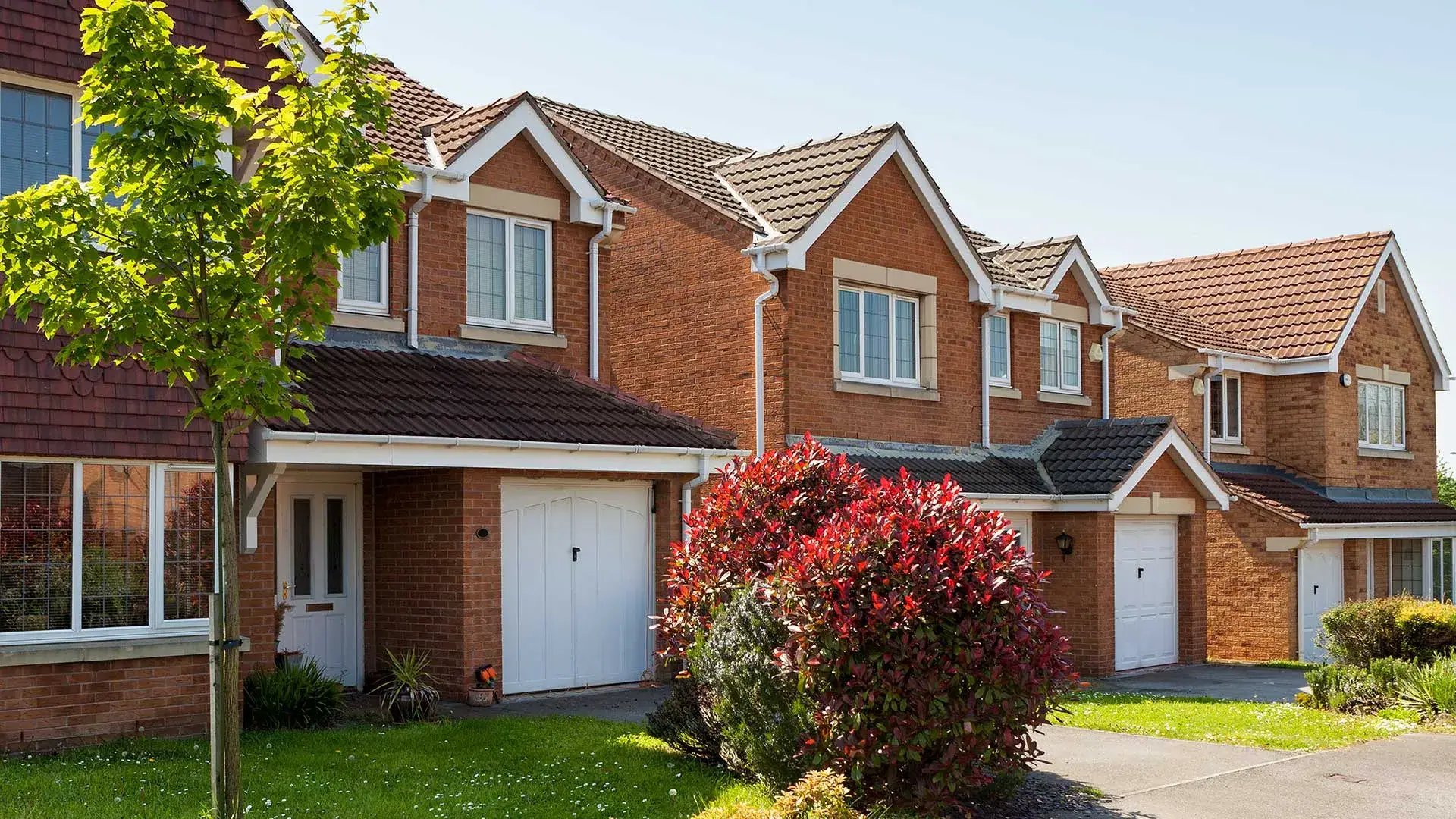an abstract photo of a curved building with a blue sky in the background