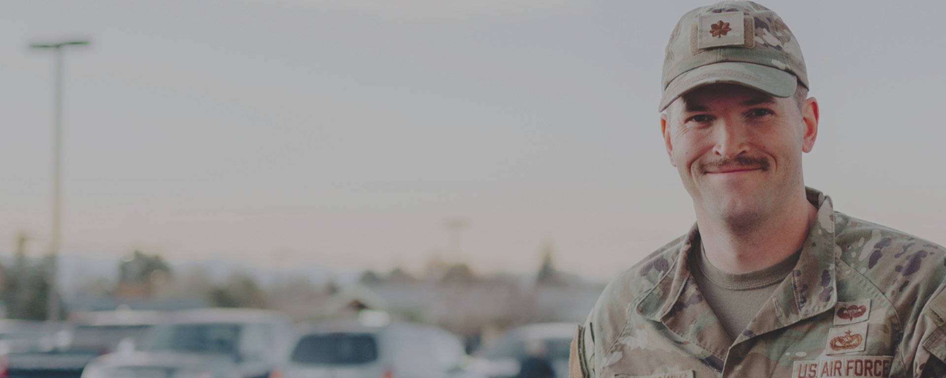 an abstract photo of a curved building with a blue sky in the background