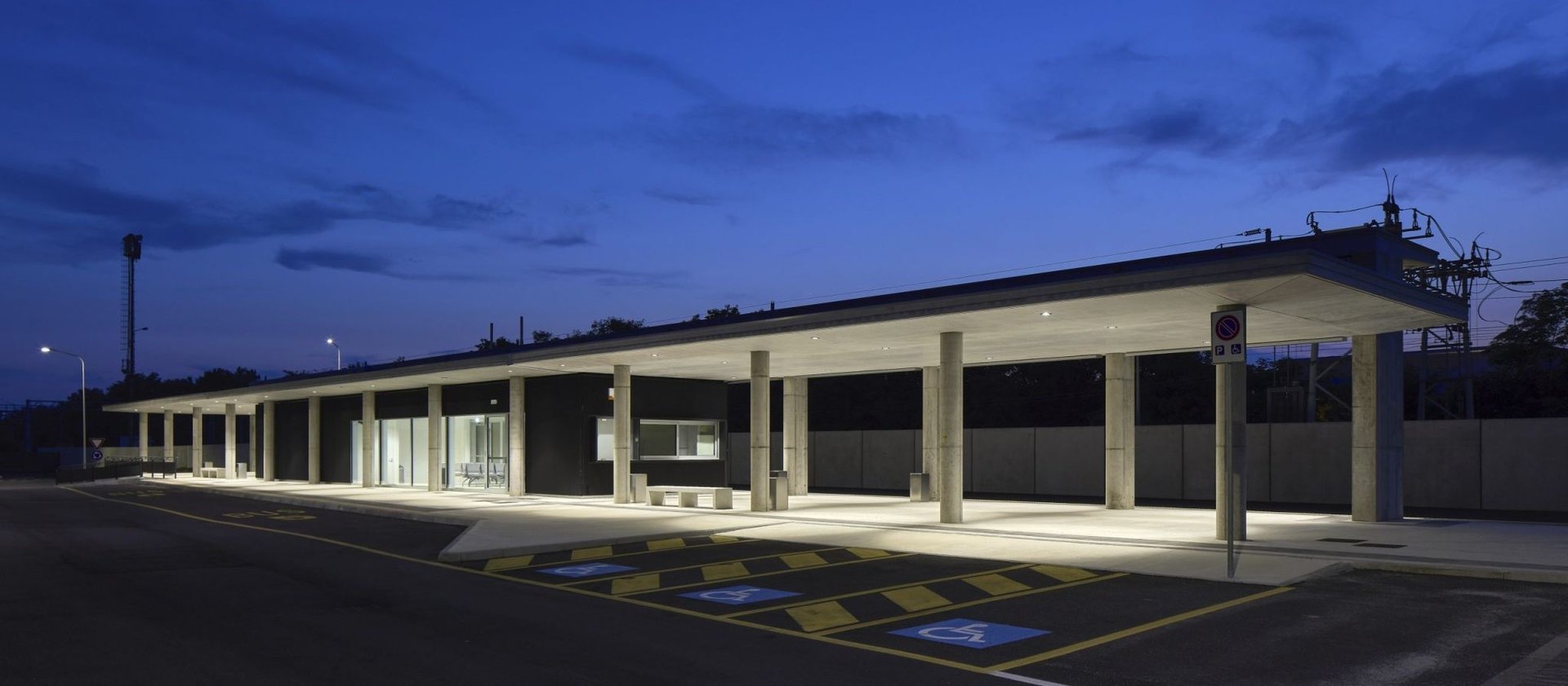 an abstract photo of a curved building with a blue sky in the background