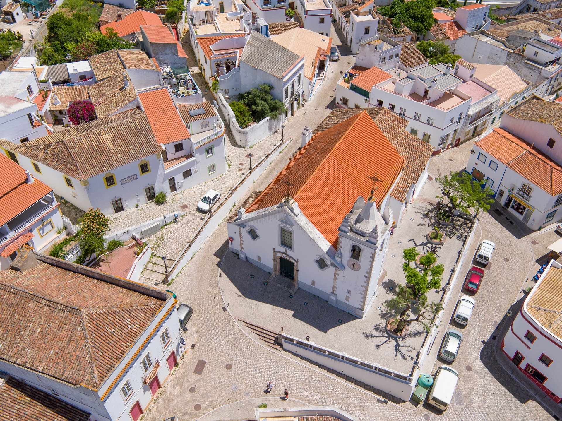 woman wearing yellow long-sleeved dress under white clouds and blue sky during daytime