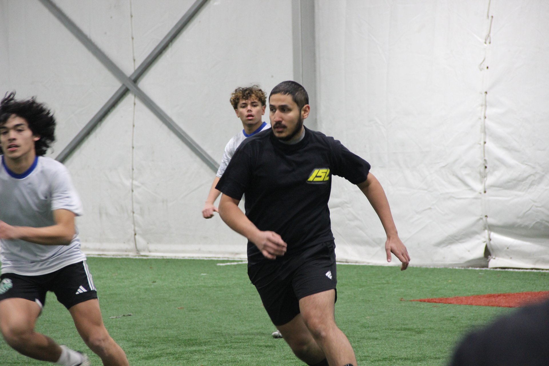 an abstract photo of a curved building with a blue sky in the background