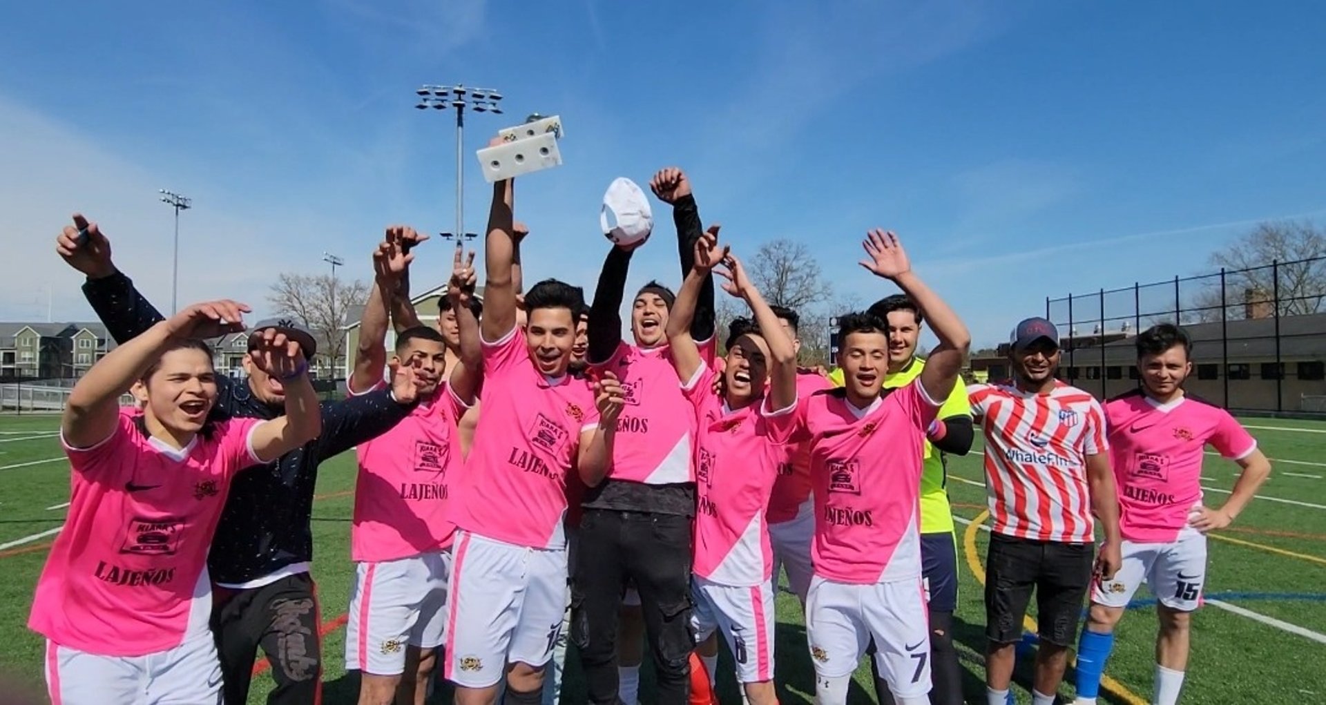 an abstract photo of a curved building with a blue sky in the background