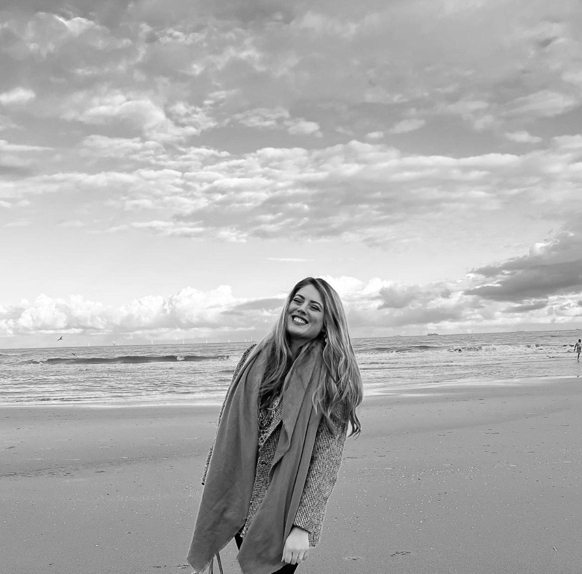 woman in white dress standing on brown grass field during daytime