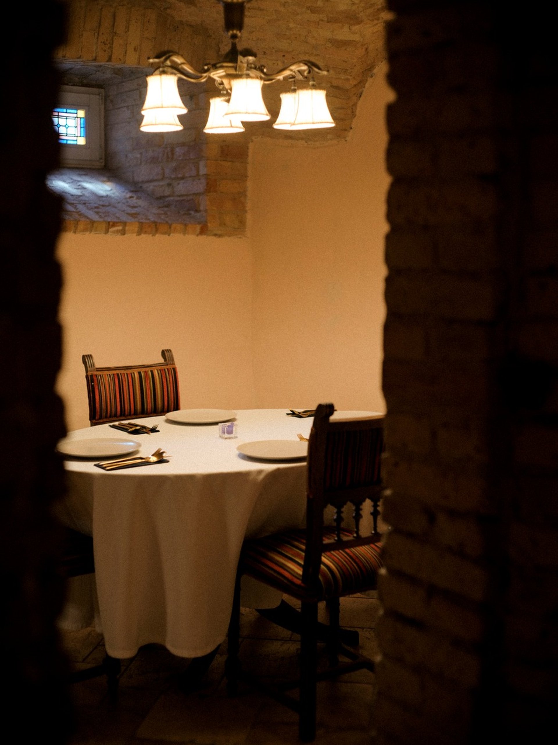 woman wearing yellow long-sleeved dress under white clouds and blue sky during daytime