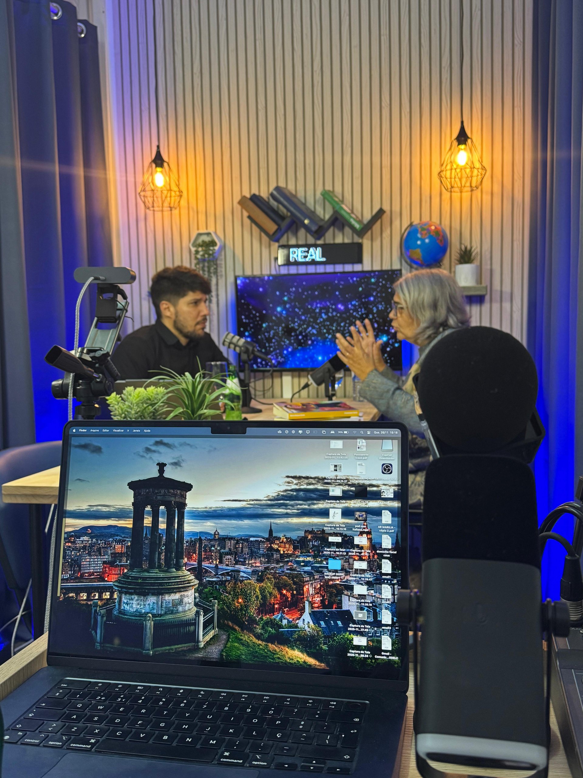 man in black long sleeve shirt sitting in front of black laptop computer