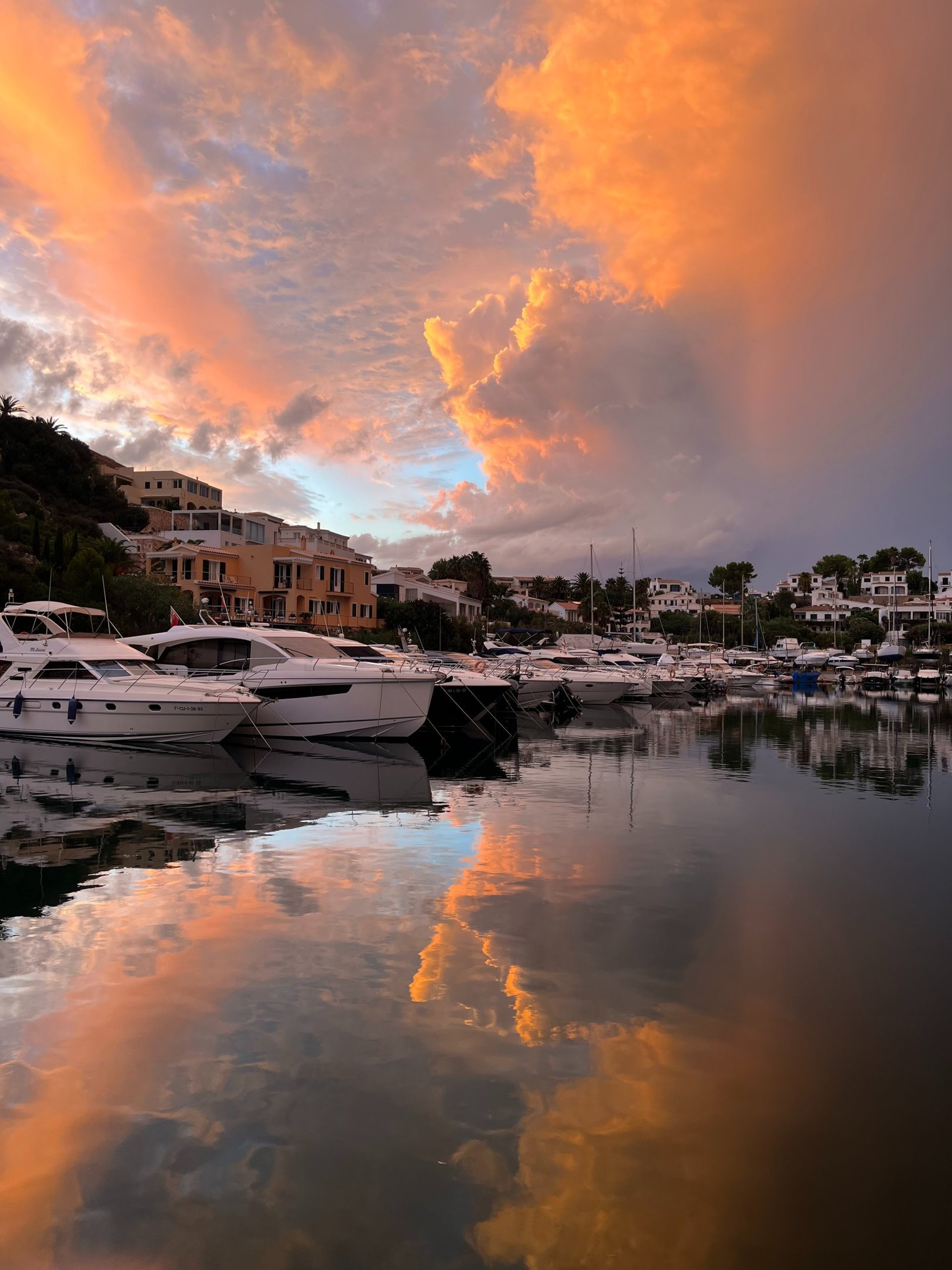 woman wearing yellow long-sleeved dress under white clouds and blue sky during daytime