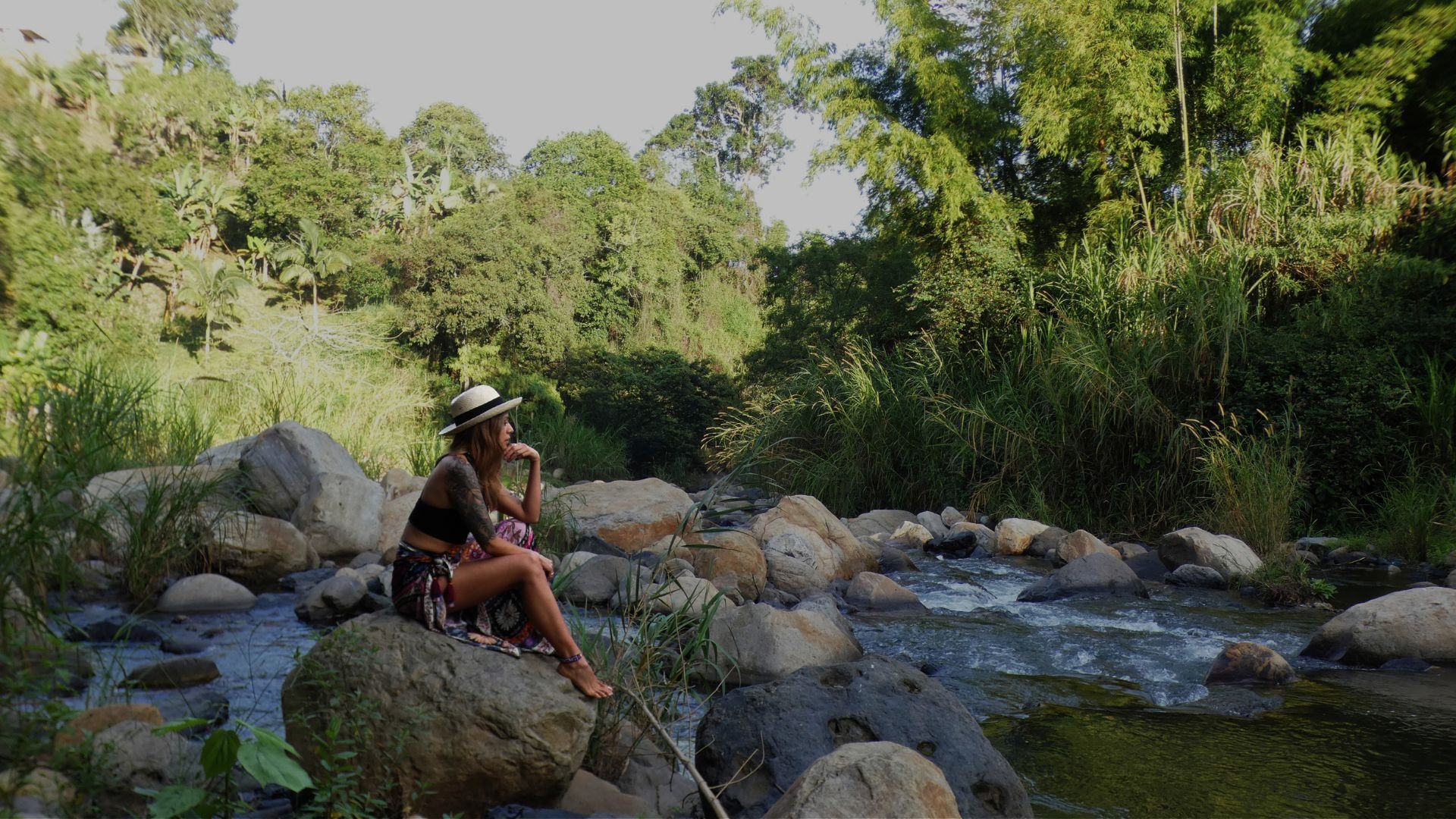 woman wearing yellow long-sleeved dress under white clouds and blue sky during daytime
